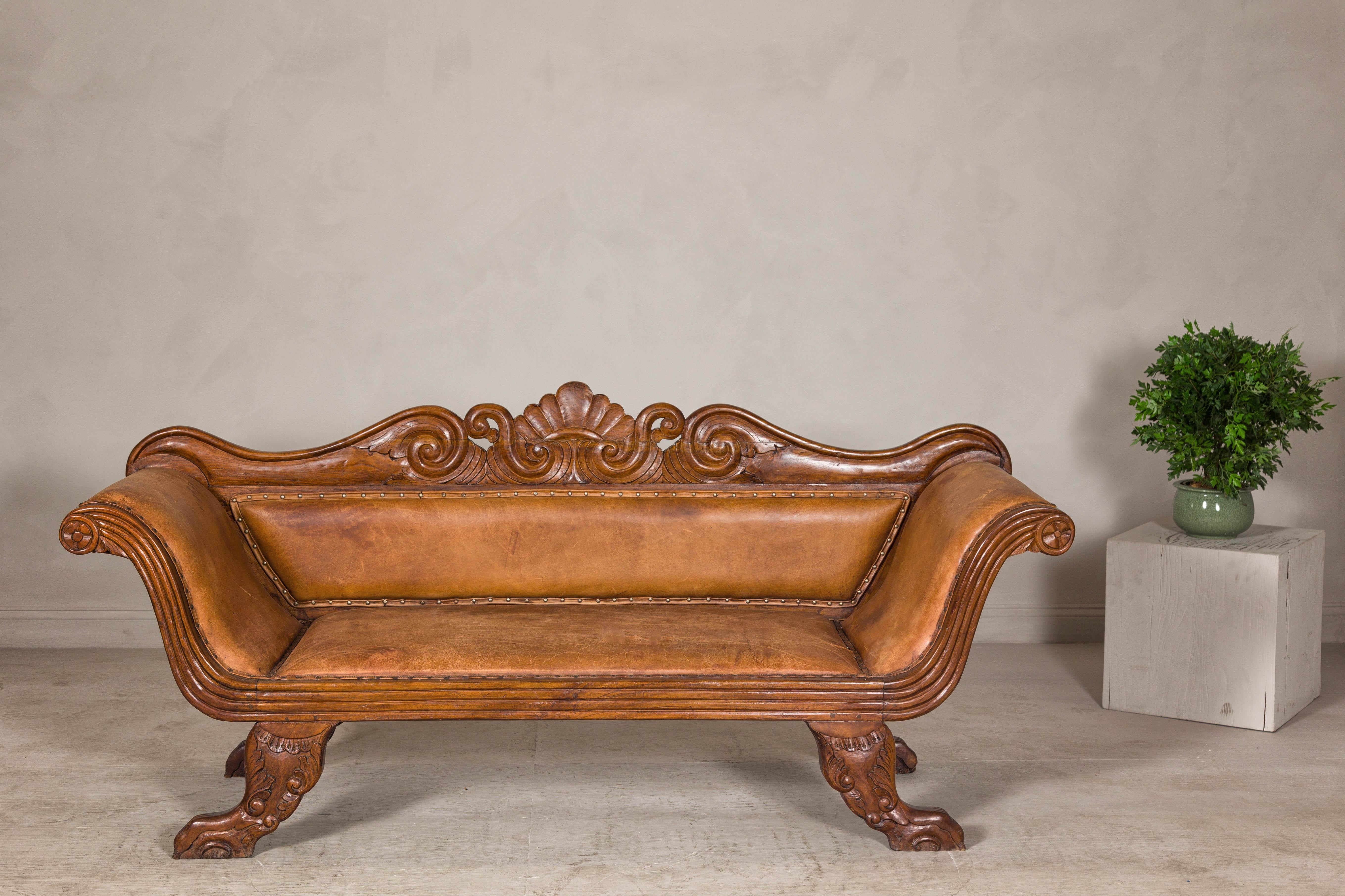 Indonesian Antique Dutch Colonial Settee with Original Leather and Carved Wood Details For Sale