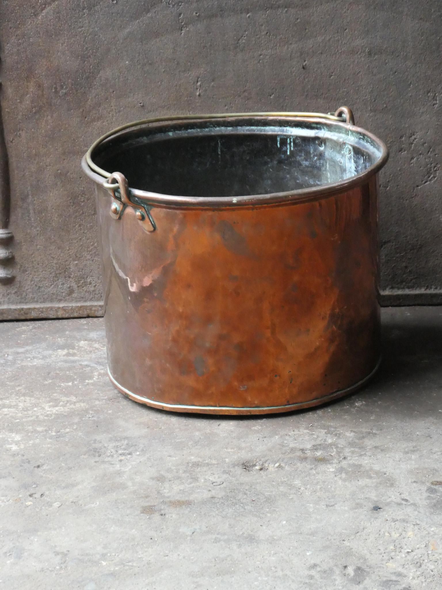 18th - 19th Century Dutch neoclassical log basket. The firewood basket is made of  copper and has a brass handle. Also called 'Frisian nail bucket'. Was used for the transportation of milk.

The log holder is in a good condition and is fully