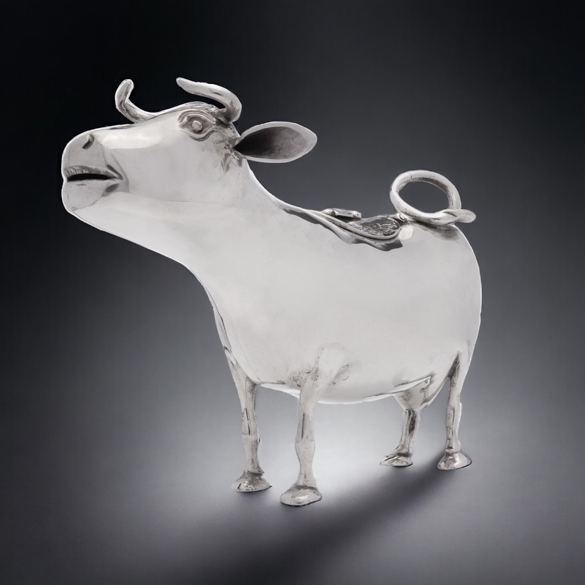 Antique Dutch Cow Shaped Creamer - Early 20th Century
Made in Netherlands, Circa 1910
Maker: DH
Fully hallmarked.

Dimensions -
Length: 13.7 cm
Width: 7.5 cm
Height: 10 cm
Weight: 141 grams

Condition: General wear and tear, great overall condition.