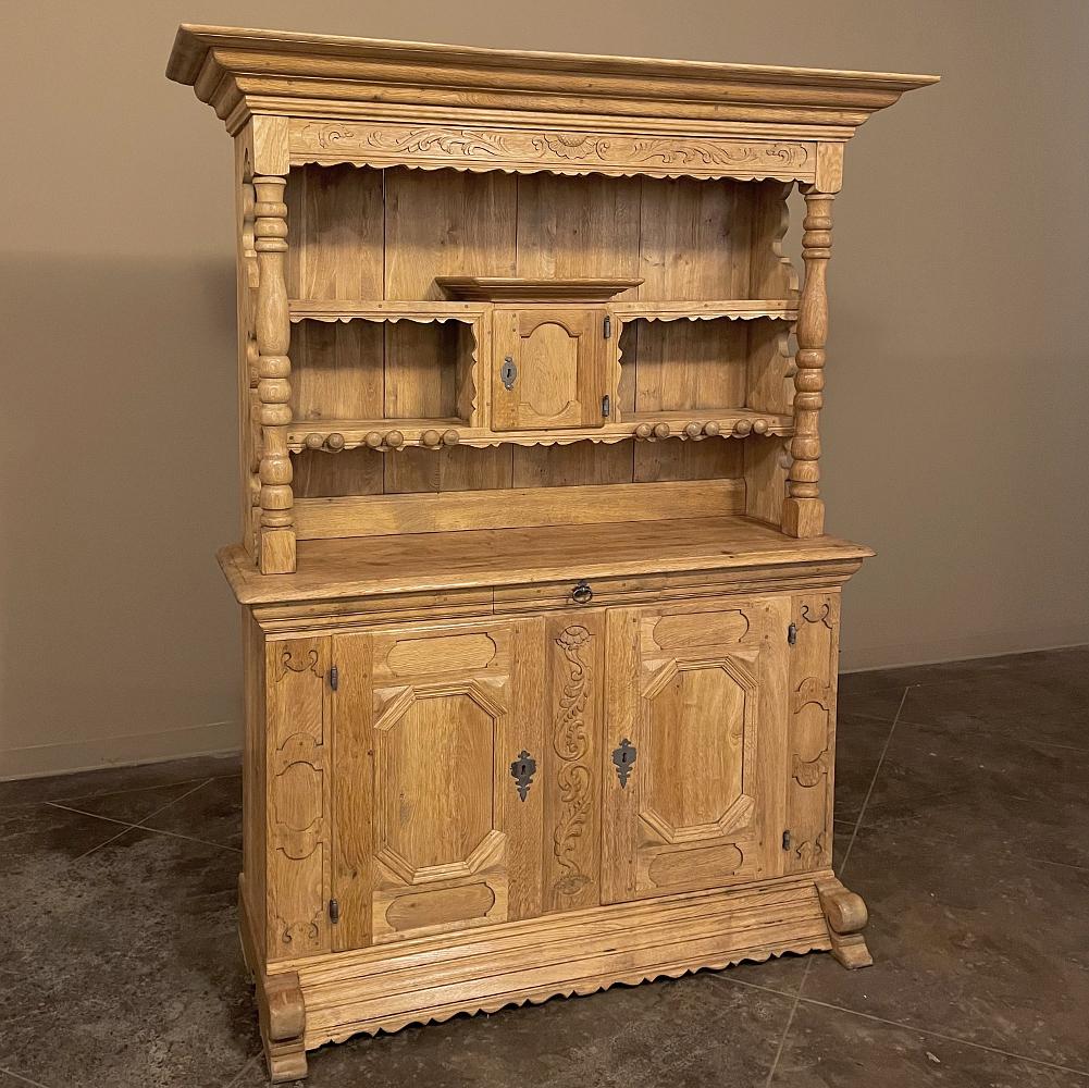 Antique Dutch cupboard ~ Vaisselier in stripped oak is a charming ode to traditional craftsmanship by Dutch masters that goes back many centuries! This example was rendered from solid white oak, and fitted with a solid, chamfered pine backing to