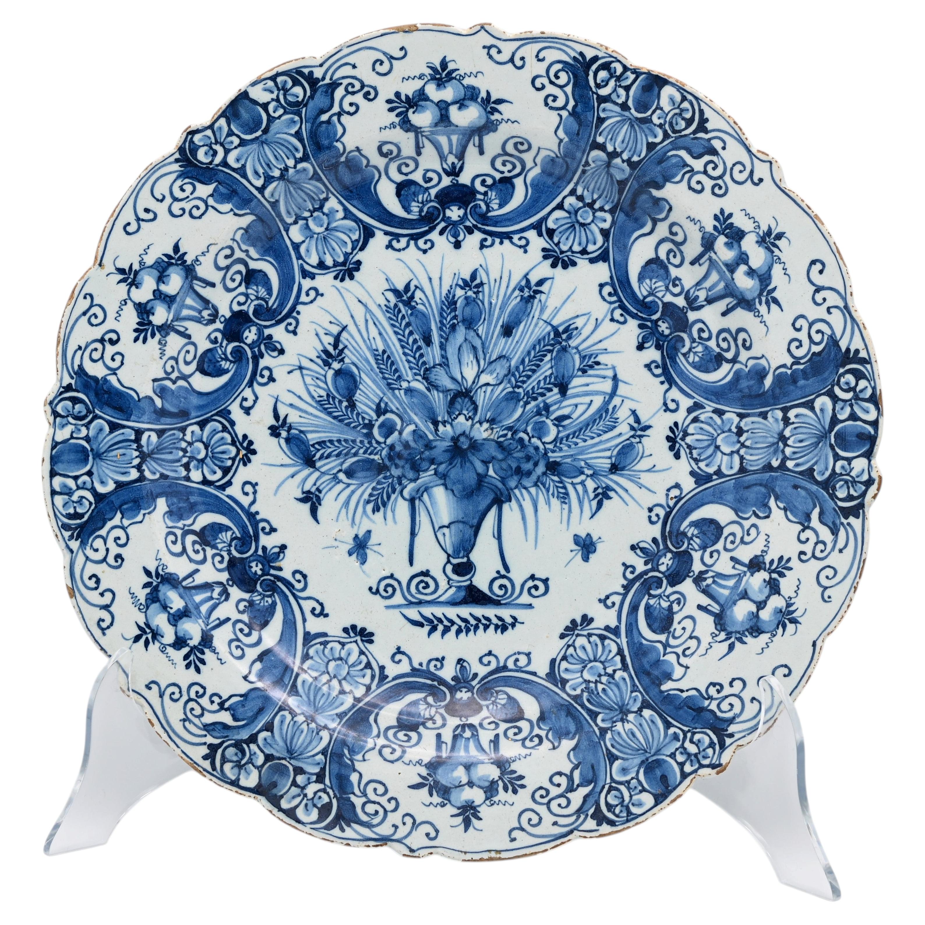 Antique 18th century Dutch Delft Blue and White Dish with a floral vase For Sale