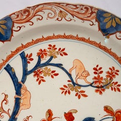 Antique Dutch Delft Charger Decorated with Monkeys Painted in Imari Style Colors