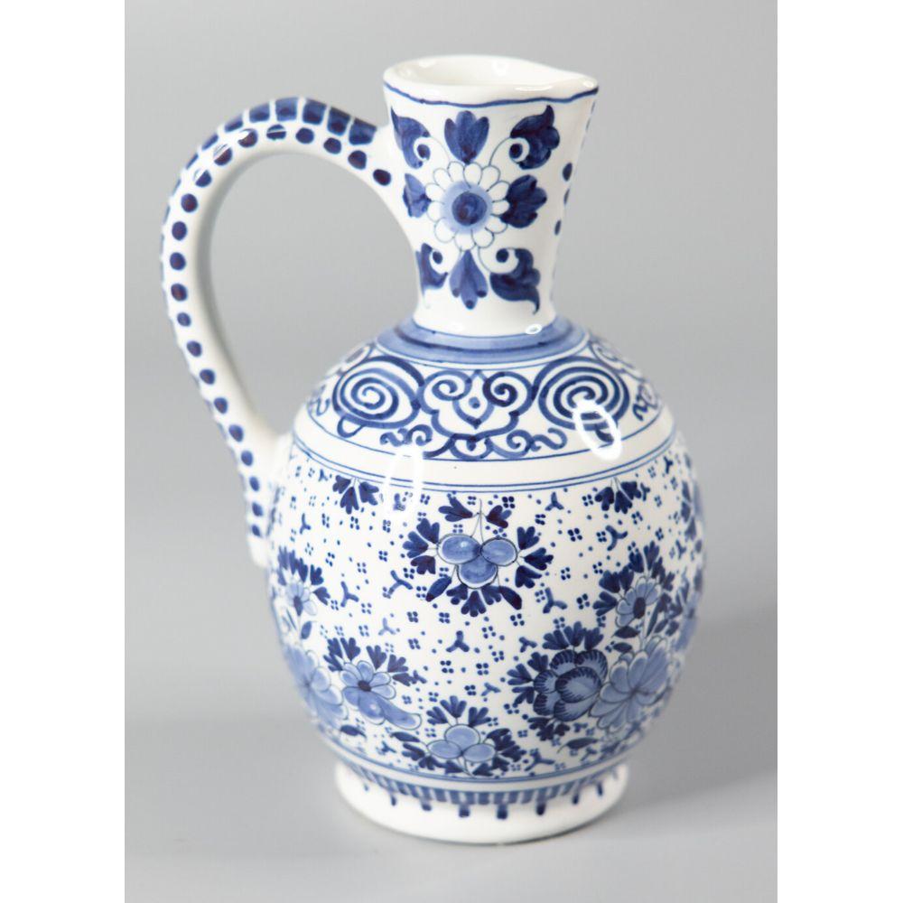 A stunning antique late 19th-Century to early 20th-Century Delft faience cobalt blue and white pitcher by Boch Freres Keramis, a well-known Belgian maker. Signed on the reverse. This gorgeous wine jug or ewer is finely hand painted with birds,
