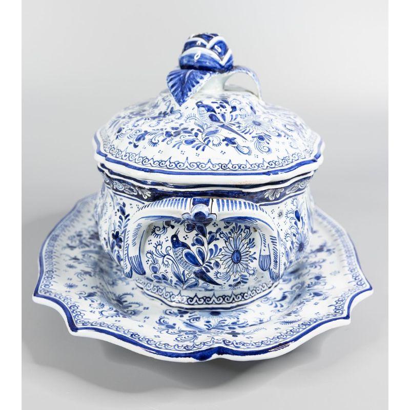 A superb antique Dutch Delft faience lidded tureen with matching underplate charger, circa 1890. Maker's mark on reverse of platter. This rare 3 piece tureen set is in excellent antique condition with fine hand painted birds, flowers, leaves, and