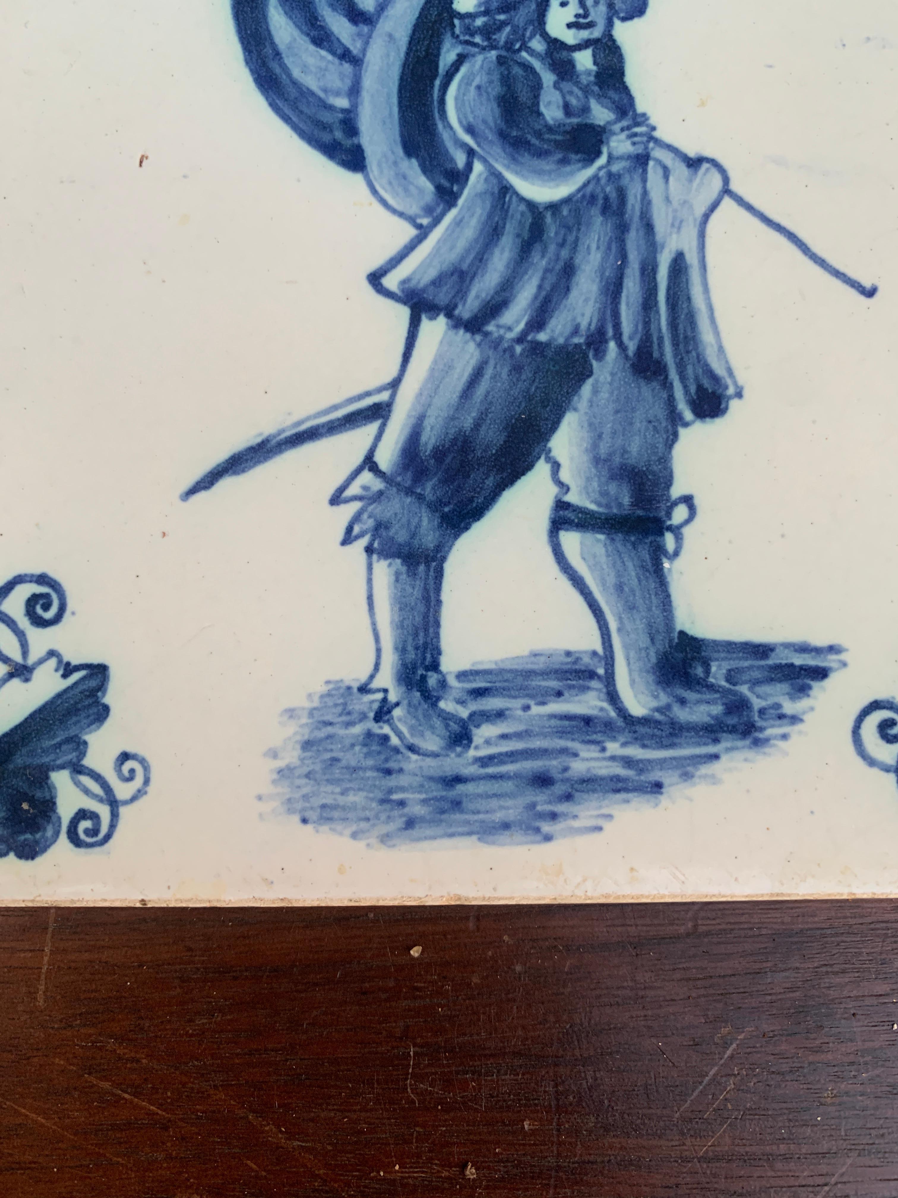 Ceramic Antique Dutch Delft Style Blue and White Tile Featuring a Soldier For Sale