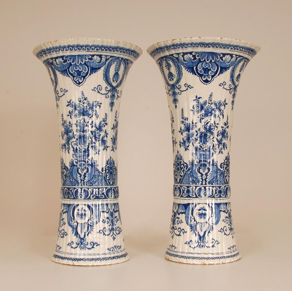 Antique Dutch Delft fluted beaker vases.
Tall decorative Chinoiserie vases .
The vases are hand crafted and hand painted in enchanting blue colours, blue camaieu.
Floral decoration with flower baskets and laurel wreath
Origin The Netherlands, Delft