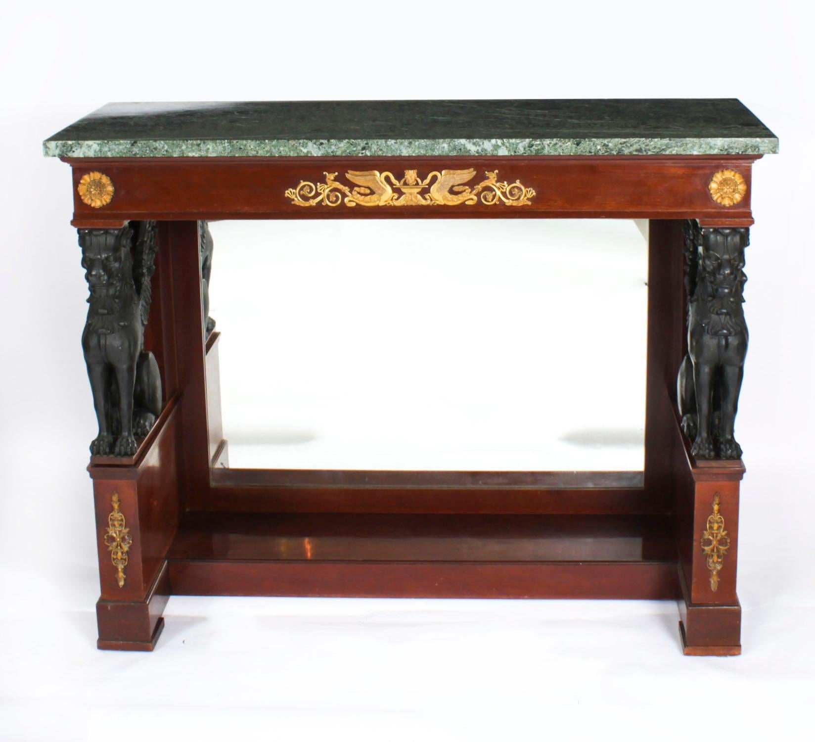 This is a beautiful antique Dutch Empire mahogany and ormolu mounted console table by Pander & Zonen Amsterdam, Circa 1880 in date.

 The rectangular 'petit granit' marble top marble top over a plain frieze with ormolu mounts, raised on griffin