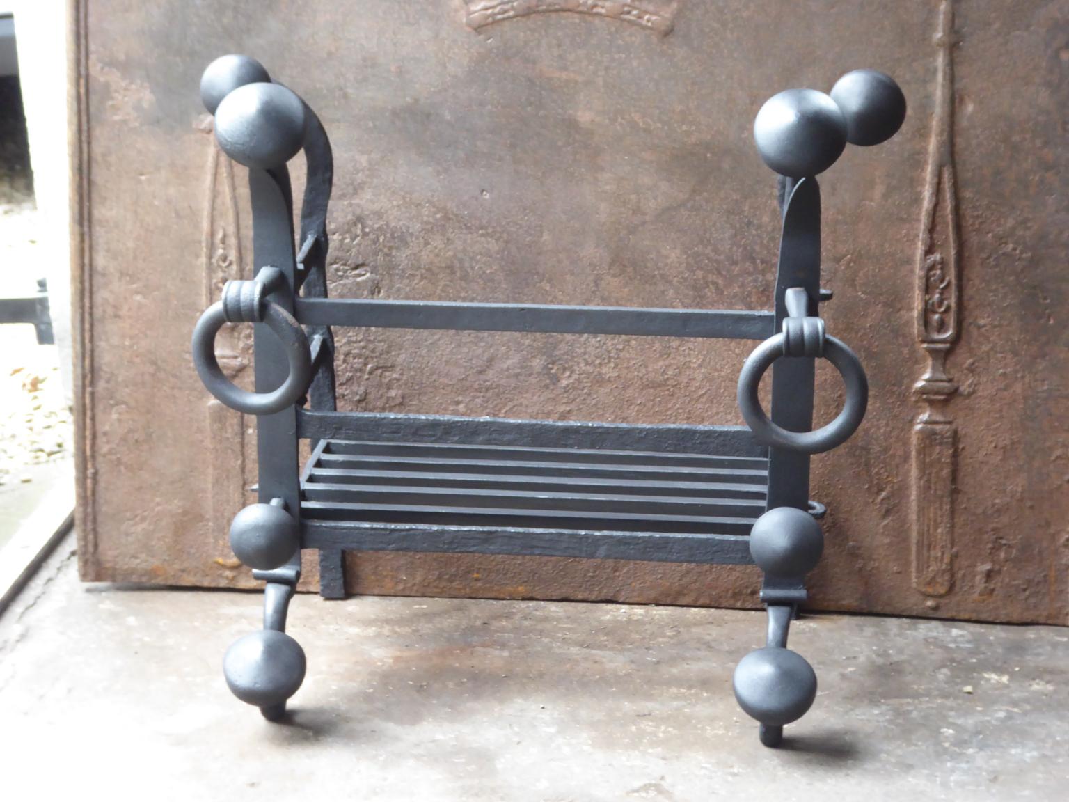Dutch 17th - 18th century fireplace basket or fire grate from the Louis XIV period. The fireplace grate is made of wrought iron. The condition is good.



















 