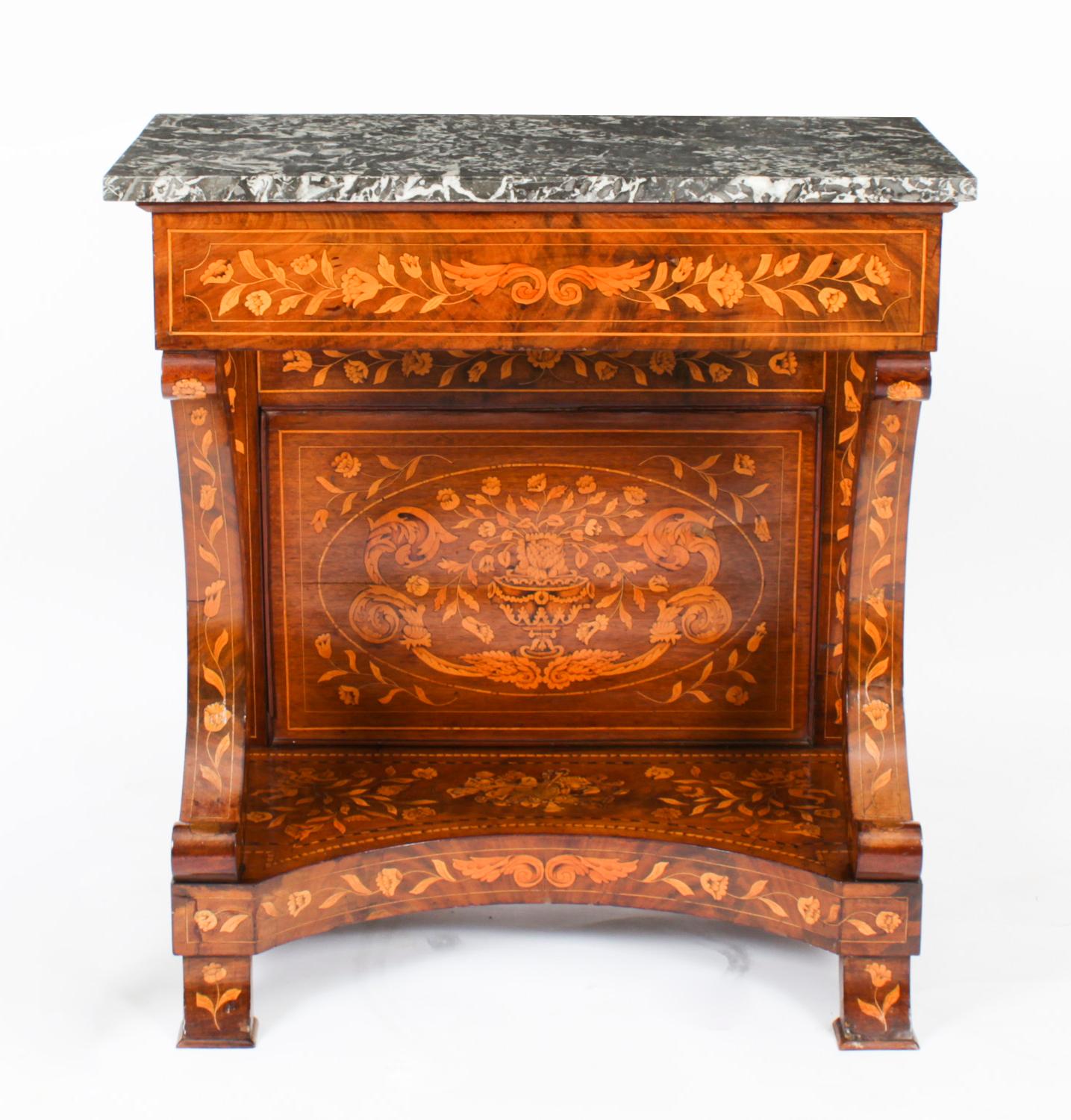 This is a beautifully crafted antique Dutch walnut and marquetry console table, circa 1830 in date.
 
This antique console table is surmounted by a stunning Gris St Anne grey marble top. The top and frieze are supported by C-scroll end supports with