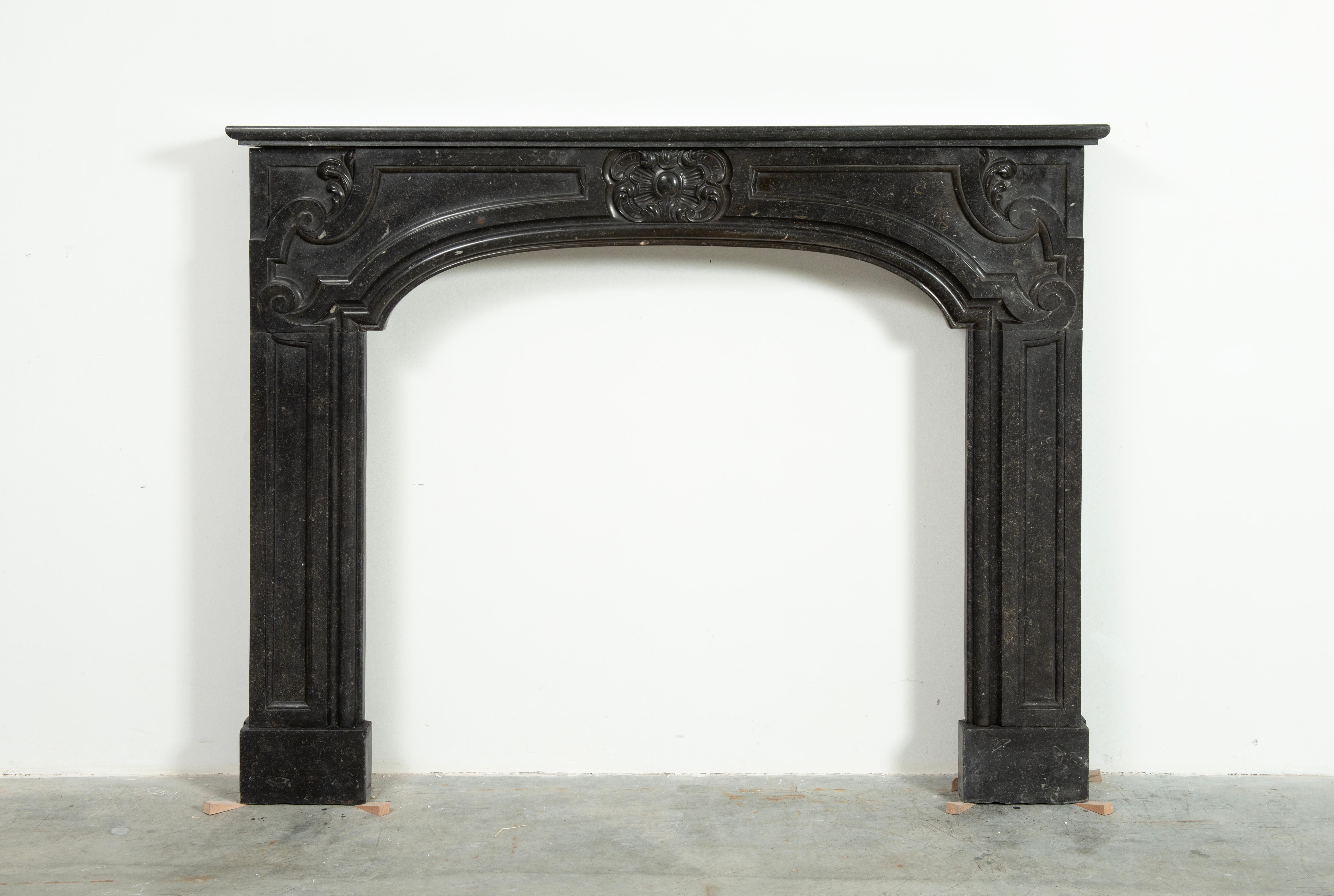 Antique Dutch Louis XIV Fireplace Mantel.

Monumental 18th Century Dutch fireplace in beautiful deep colored Belgian bluestone.
The perfect shimmer and color really make this stand out in any room and situation.

The thick profiled topshelf rest on