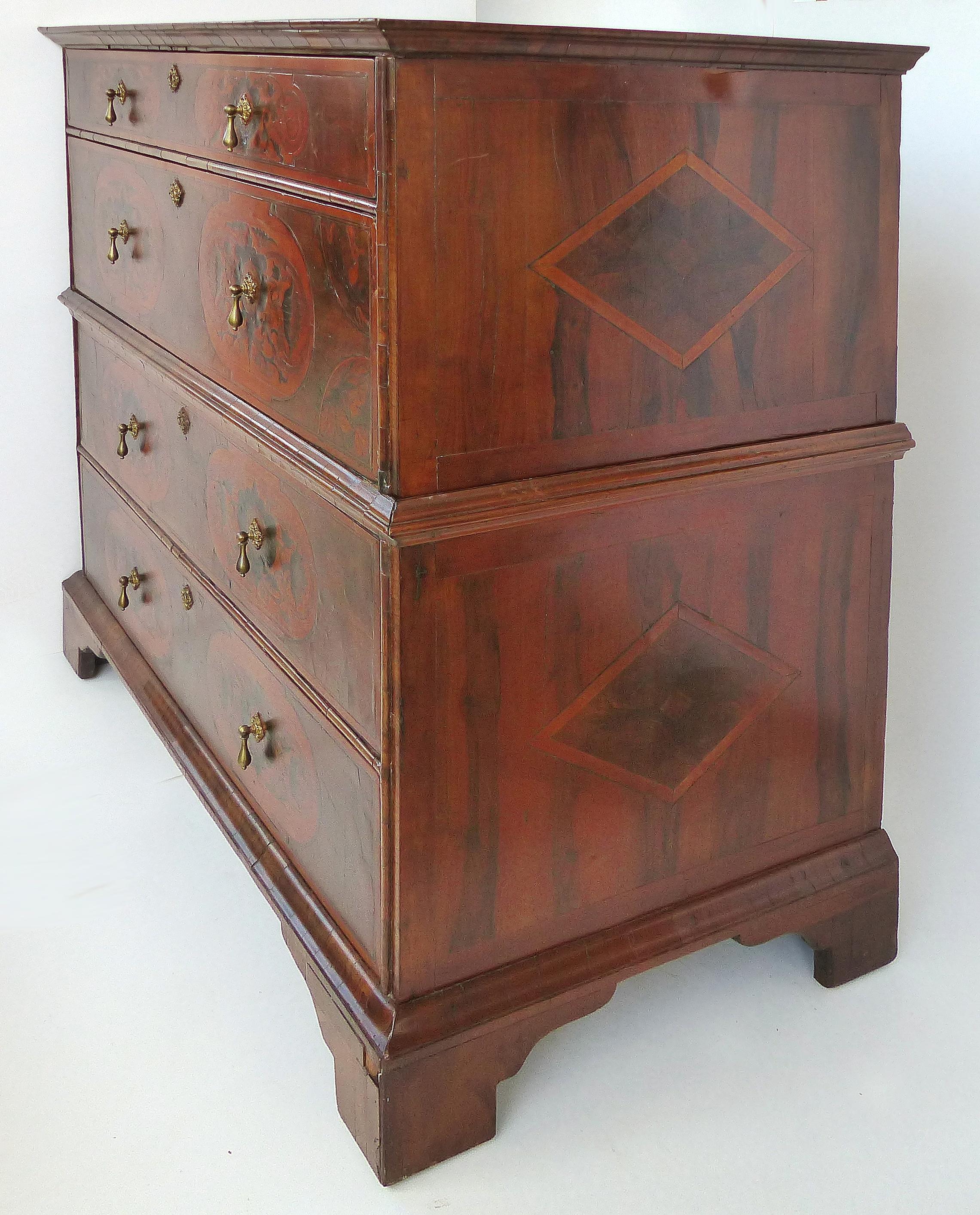 Antique Dutch Marquetry Chest on Chest

Offered for sale is an early 19th century or possibly earlier Dutch marquetry chest on chest with two drawers in each section which are raised on simple bracket feet. This wonderfully detailed marquetry chest