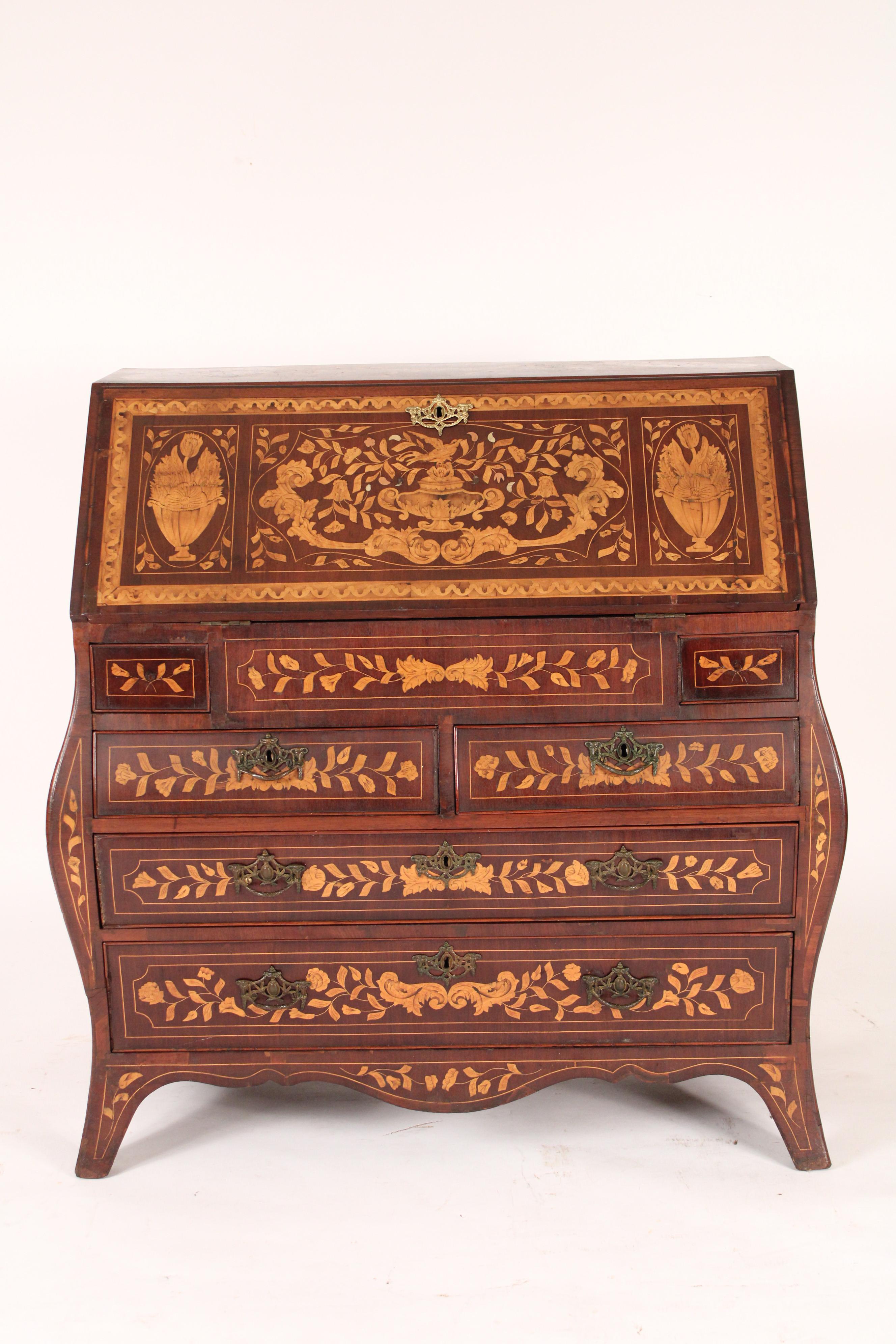 Dutch marquetry bombe form slant top desk, late 19th century. With exquisite floral marquetry throughout, stepped interior and hand dovetailed drawer construction.