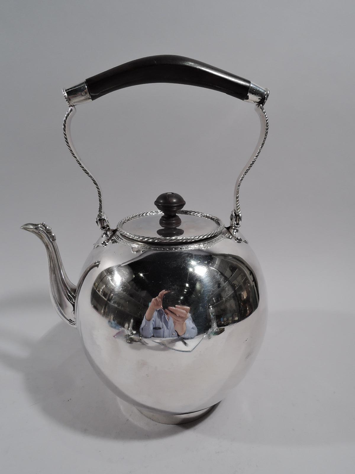 Dutch Neoclassical 875 silver teapot, 18th century. Globular body on short and inset straight foot. S-scroll spout with bead and flower cap. Cover has stained-wood finial and gadrooned rim and sits flush in mouth with raised ornamental border.