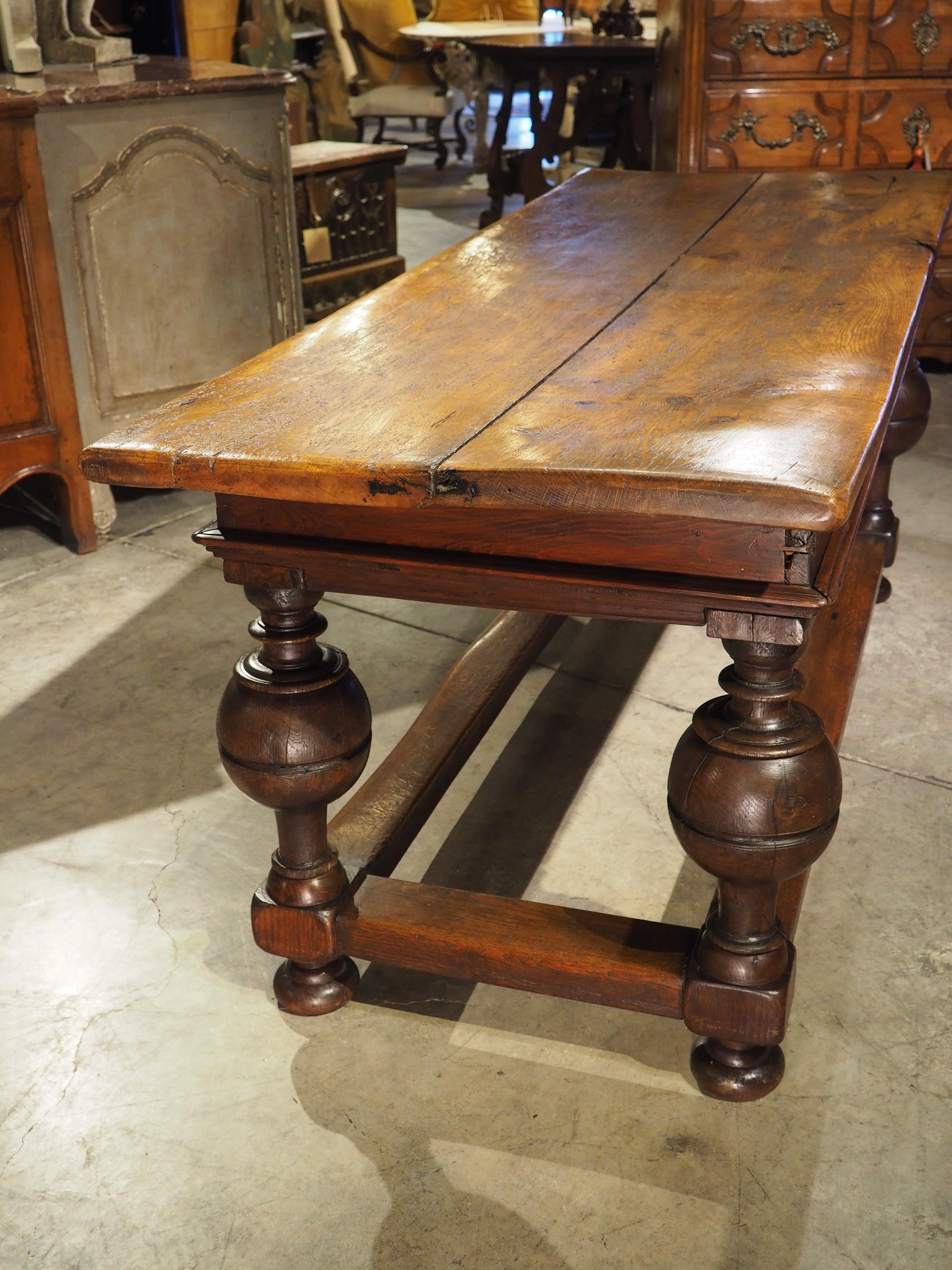 This handsome ball leg table was hand-carved in the Netherlands using both oak and pine. Known as a “bolpoottafel“, the design incorporating large ball legs is instantly recognizable and sought after for its unique appearance.

Made from two