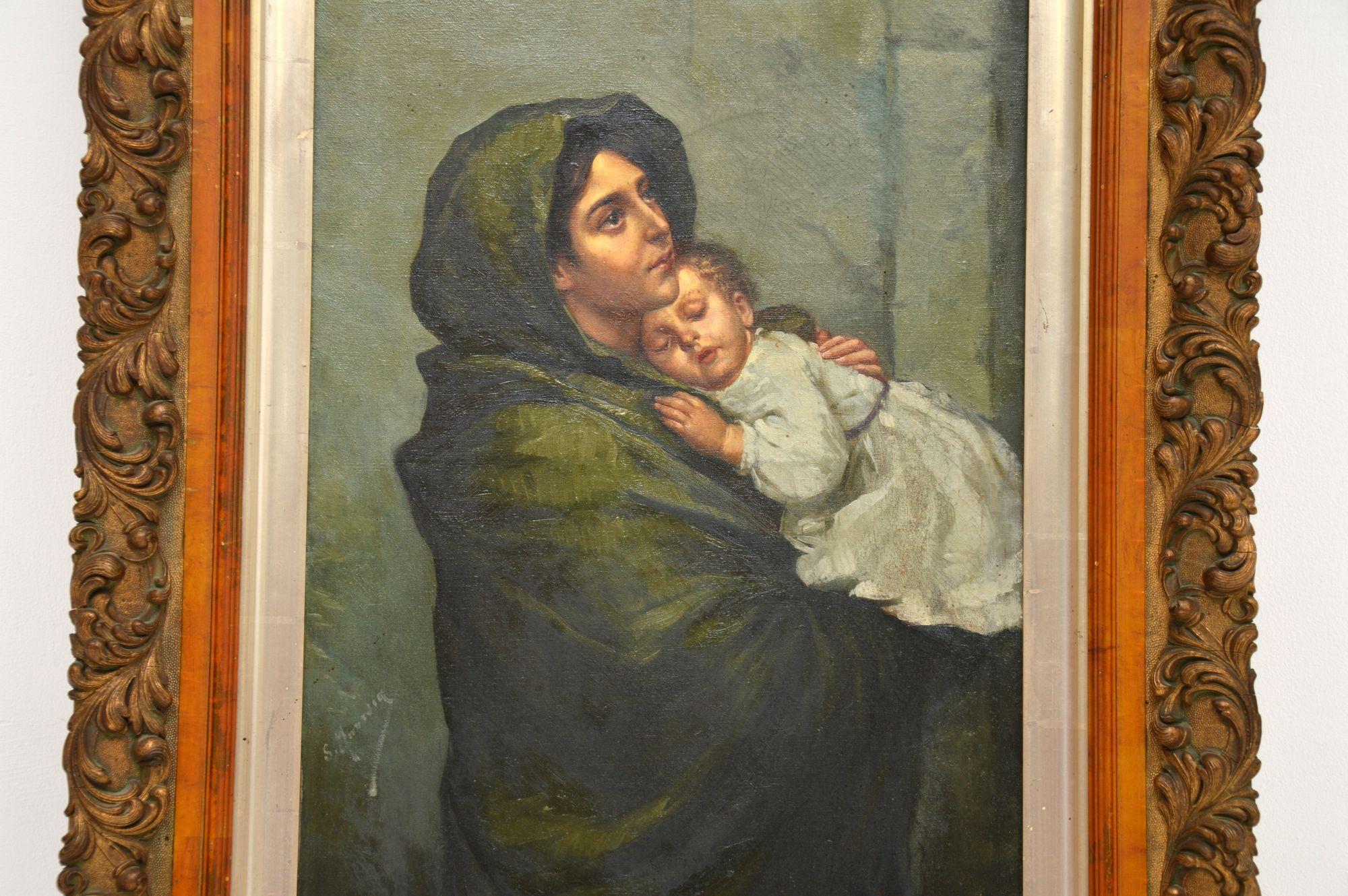 A beautifully executed antique Dutch oil painting in a gilt wood frame, depicting a mother and baby, dating from around the 1860-1880 period.

It is a beautiful and touching subject, executed with great skill and it is signed by the artist, though