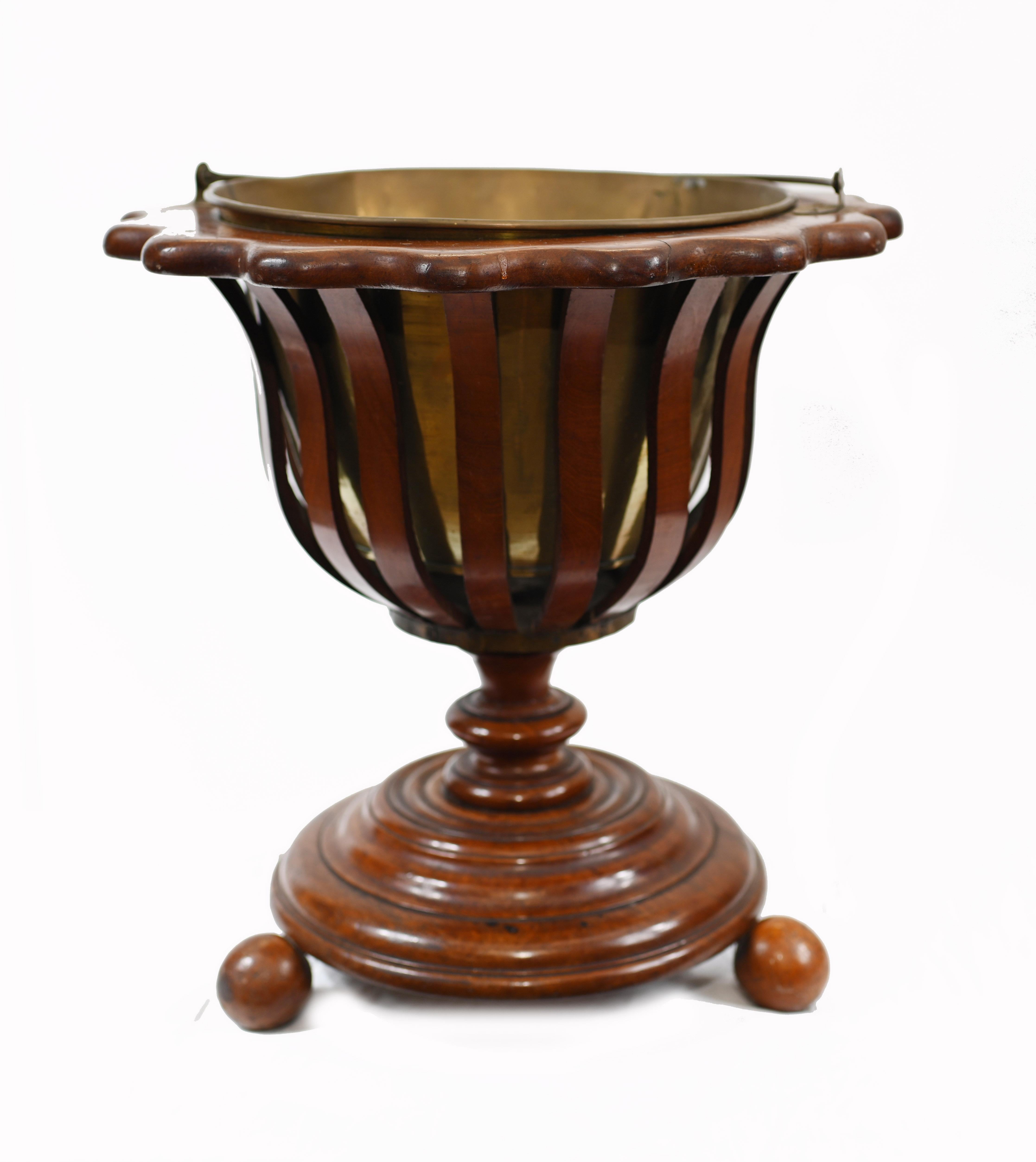 These buckets were originally used as braziers for holding charcoal and a tea-kettle
Crafted from moulded staves of ebony, walnut and holly and has original brass liner
Make for a great decorative piece or as a planter
We date this to circa