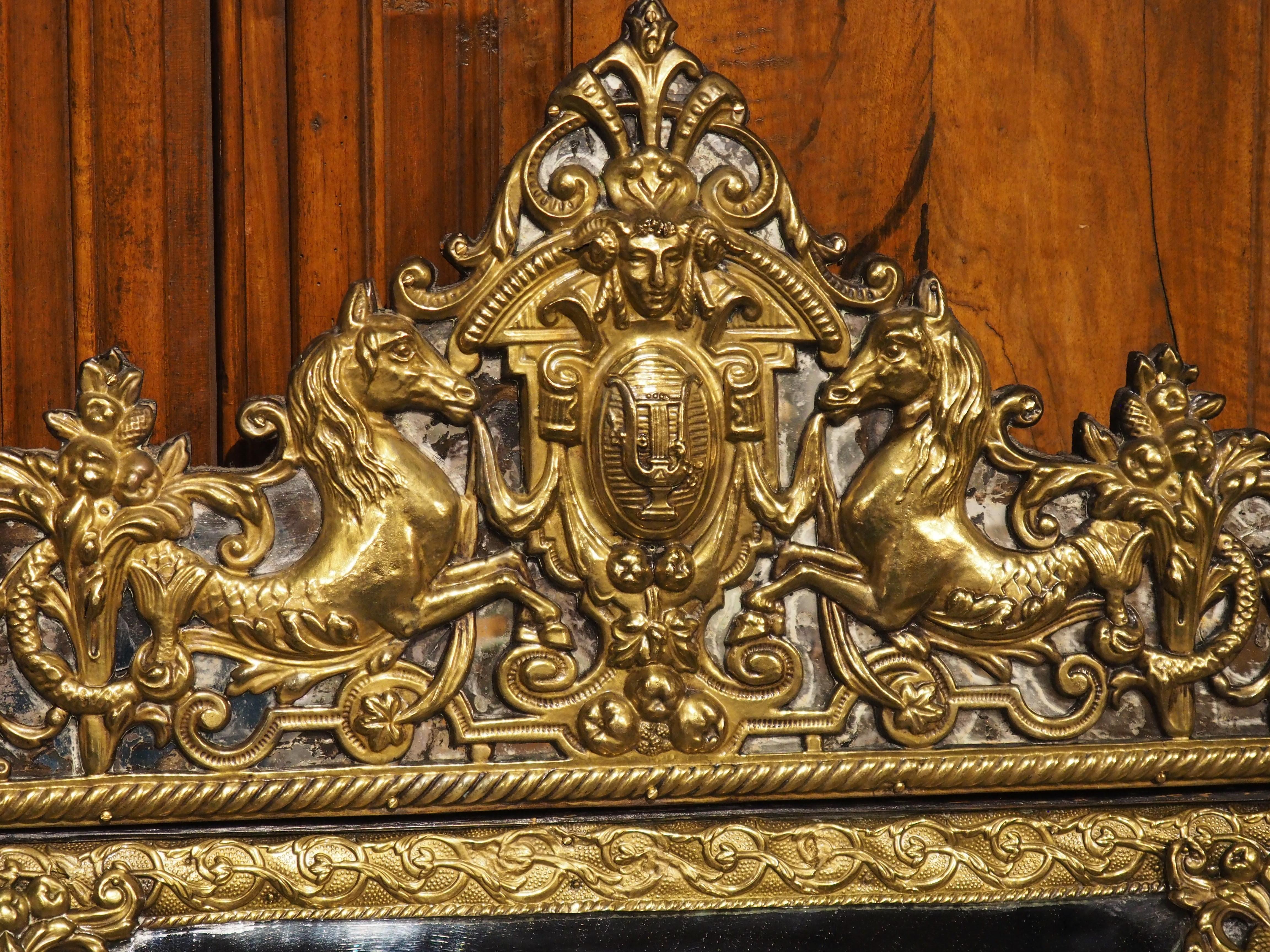 *Mirror can be hung horizontally, with slots available for crown to be mounted in either direction

Produced in the Netherlands, circa 1890, our repousse cushion mirror is adorned with lyre and seahorse motifs. Repousse is an artistic technique