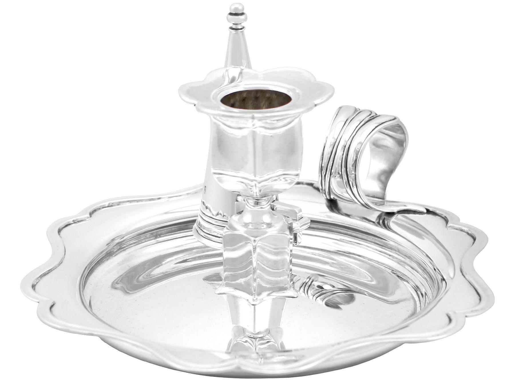 An exceptional, fine and impressive antique Dutch silver chamberstick; part of our silver candlestick / candelabra collection

This exceptional antique silver chamberstick has a circular shaped rounded form.

The subtly domed centre of the plain