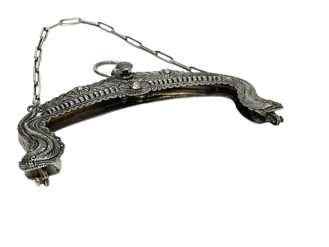 Antique Dutch silver purse mount by Keulemans Rotterdam, 1841

An antique purse mount with ring and chain. With motif of dolphins and a shell-shaped knob. The ring, the opening bracket and the bracket itself are Dutch silver hallmarked 
with the