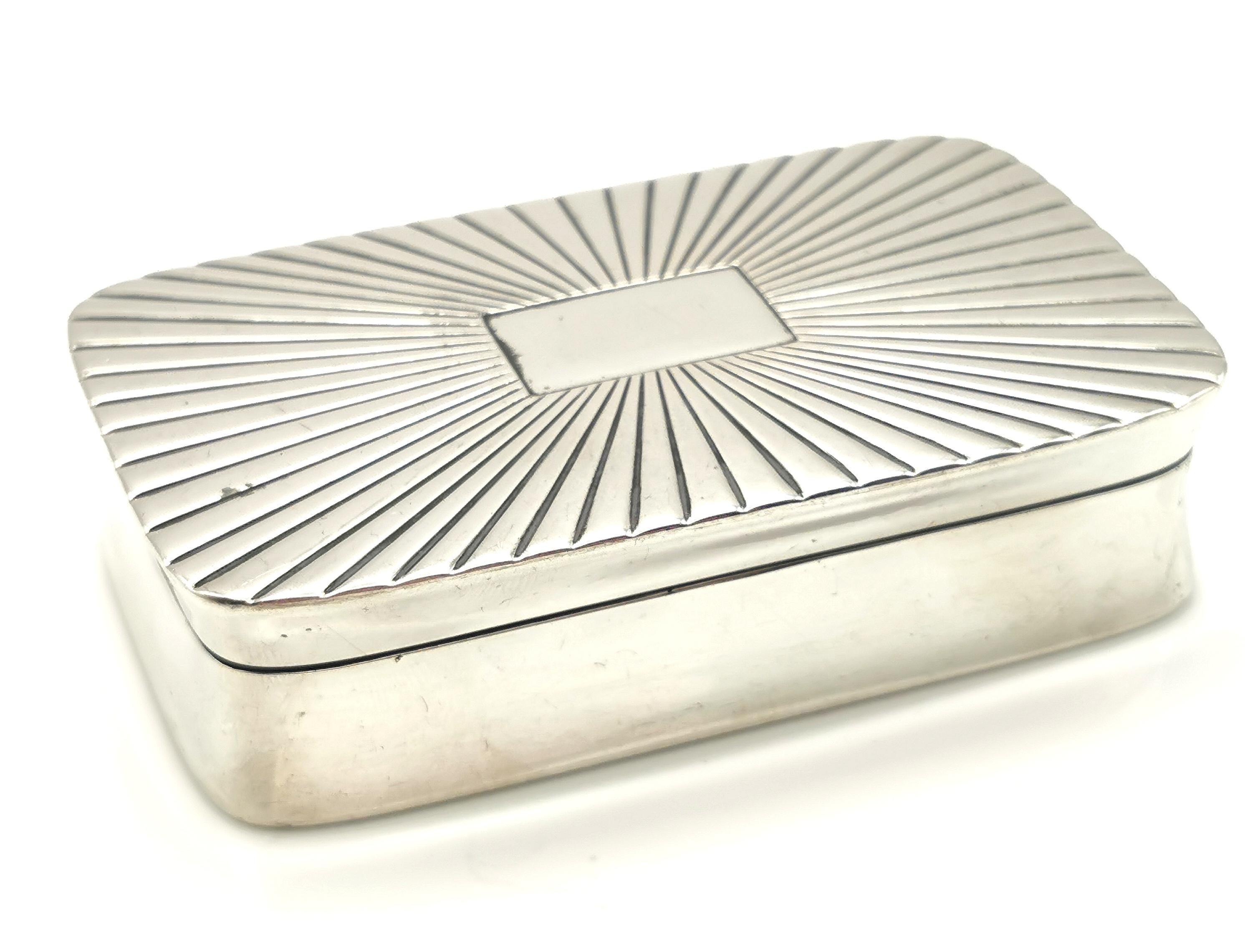 A fine antique 19th century Dutch silver tobacco or snuff box.

It is a larger box than a standard snuff so could have been used as a tobacco box or a larger snuff box.

It is a rectangular shape with slightly canted sides and a decorative sun ray
