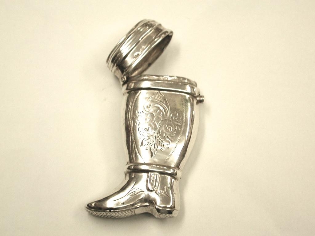 Antique Dutch silver vesta case in the shape of an officers boot.
Dated circa 1870.
833 standard silver.
With sprung push button opening and striking surface underneath.
 