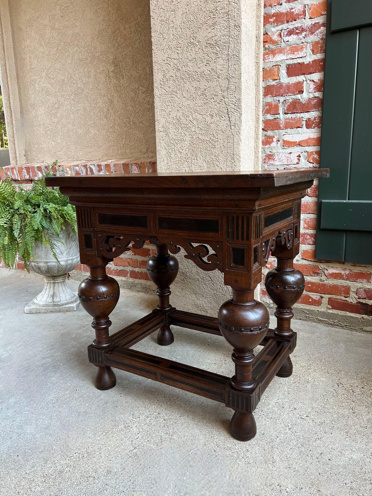 Antique Dutch Sofa Side Table Carved Oak Bulbous Leg Baroque Ebonzied Danish.

Direct from Europe, a distinctive antique European table with a stunning silhouette, versatile size, and distinctive style, certain to command attention, and compliment