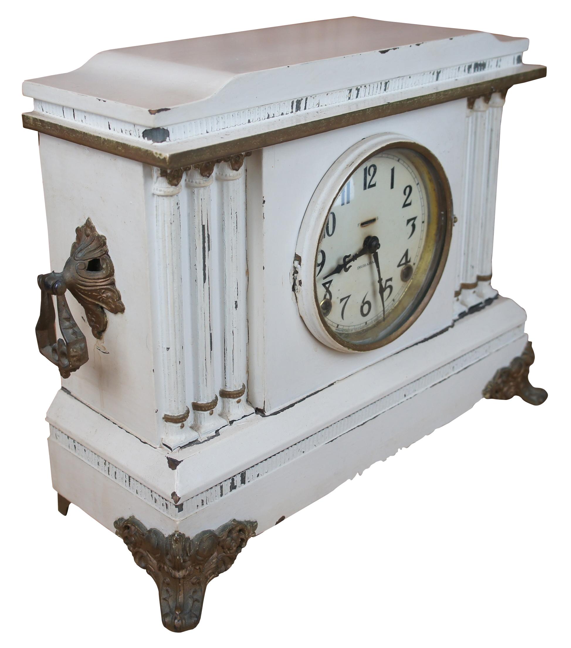 Antique Ingraham 8 day Mantel clock in white with ornate Victorian finishes with ormolu feet.
 