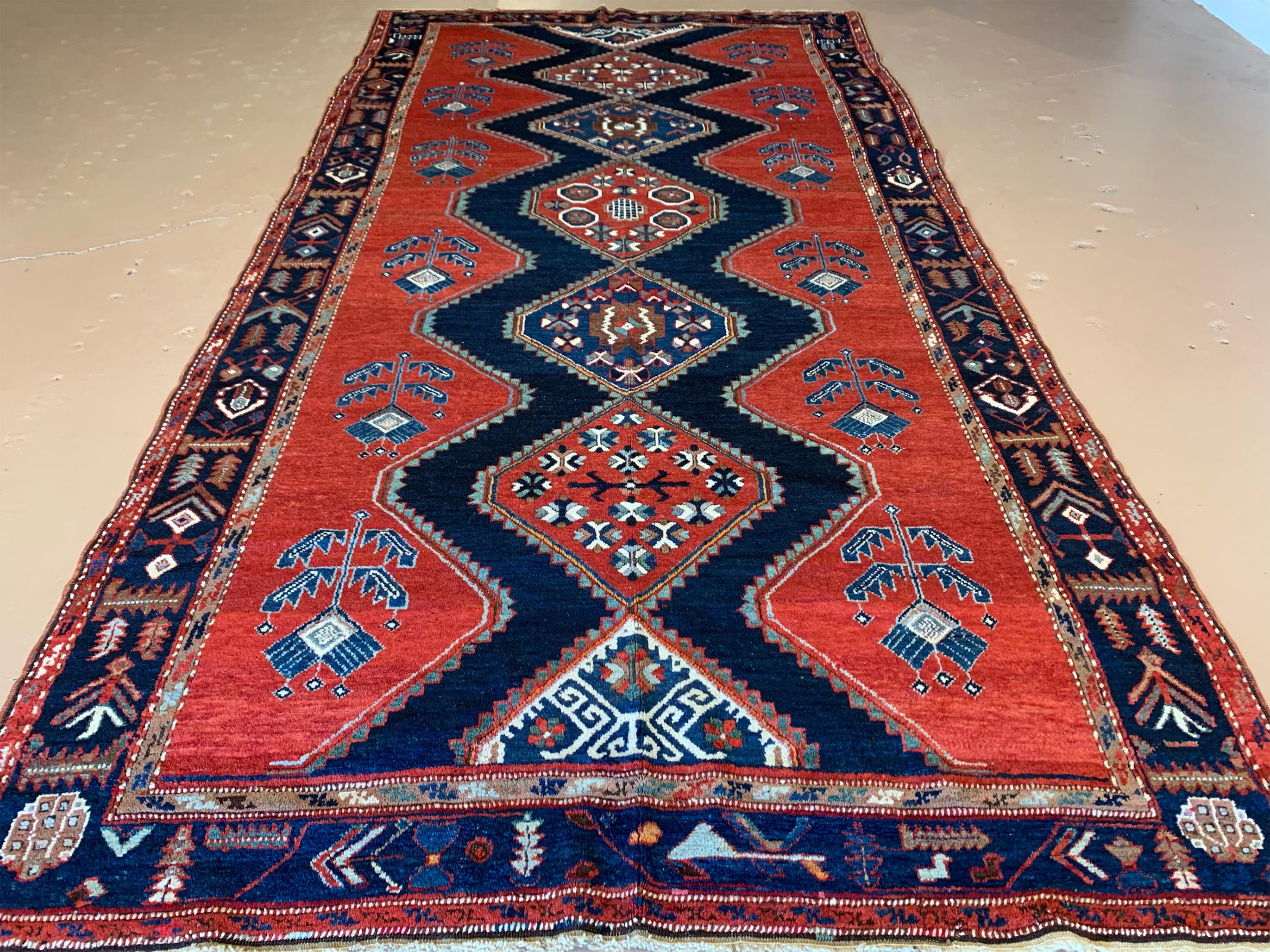 This is an antique hand-knotted Eagle Kazak rug, made in Caucasia in the late 1800s. It is wool pile on wool warp and weft, with all vegetable dyes and is approximately 6’3 x 12’ ft. This is a rare size, as these are usually much shorter.

Bold