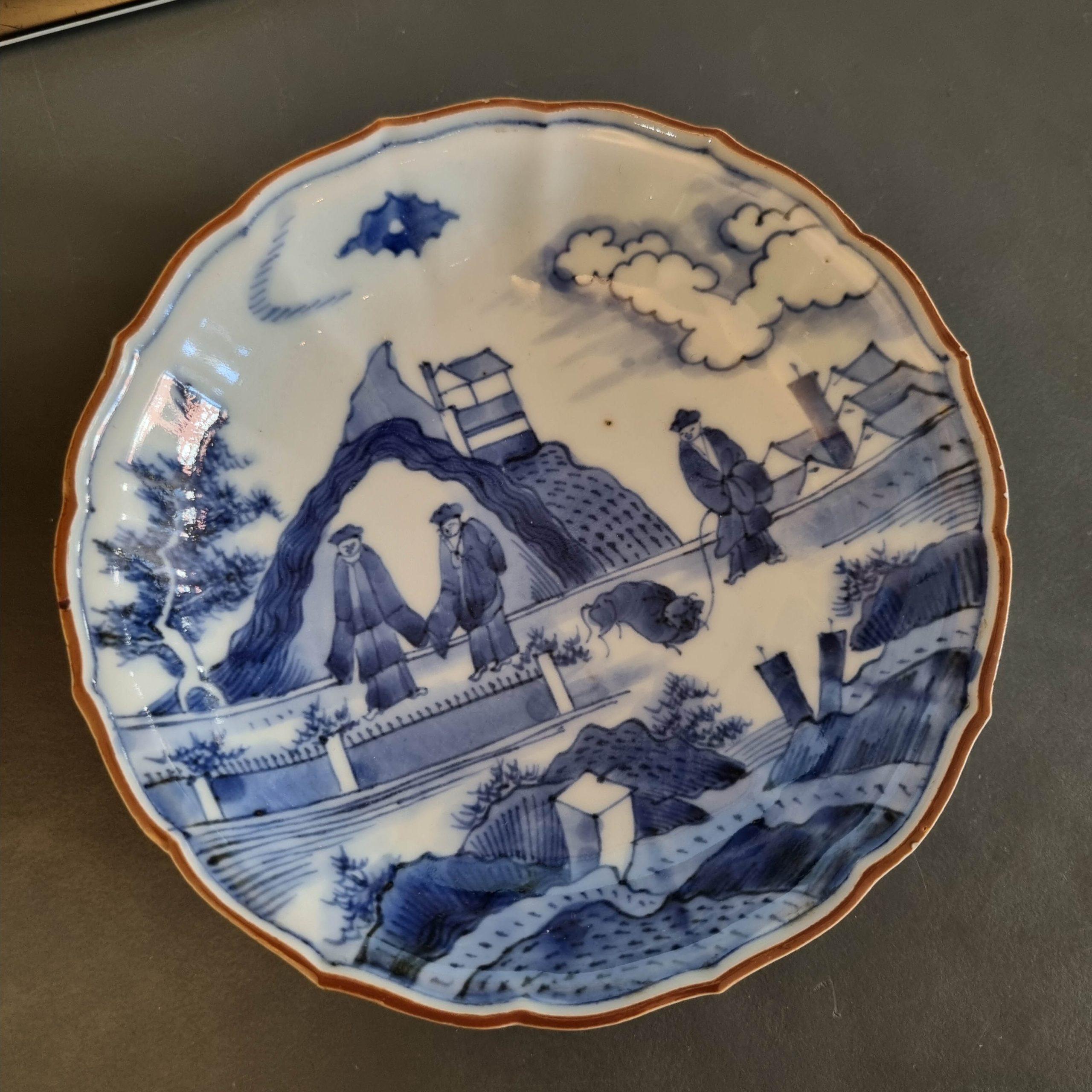 Sharing with you this beautiful Blue and white dish, Arita early 18th century.

Underglaze blue on base: square kotobuki mark. Octagonally-petalled plate. Flanged brown-edged rim. Underglaze blue
variation of the Deshima Island or Scheveningen