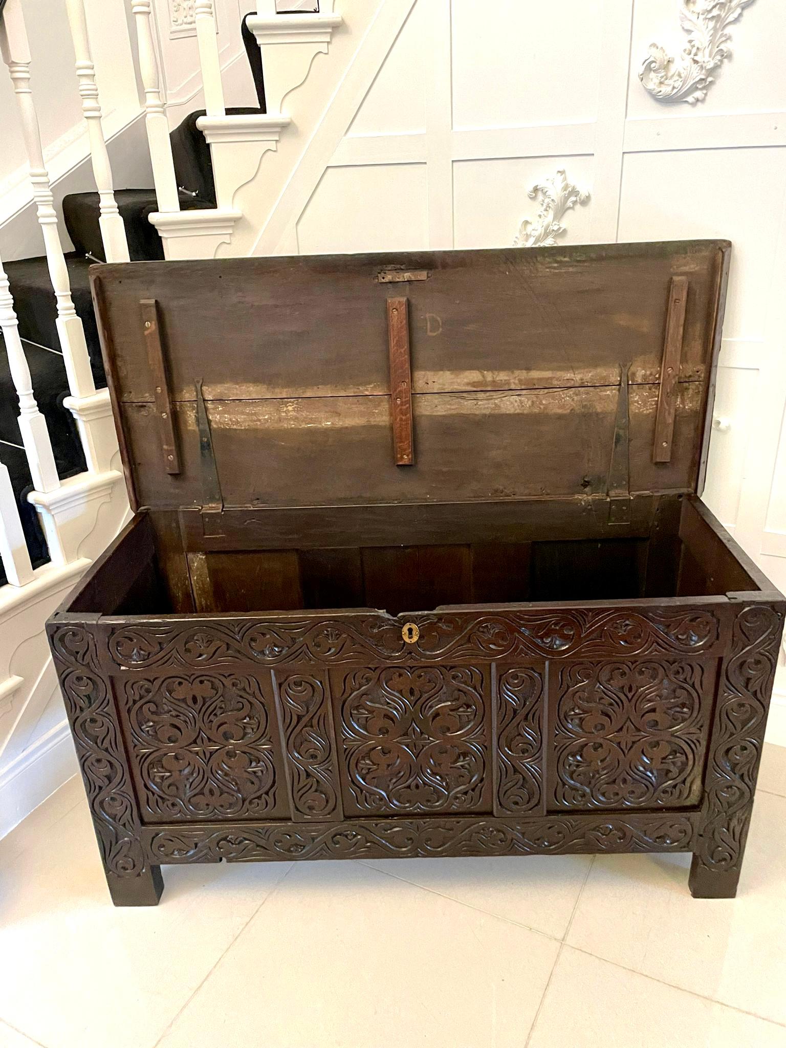 Antique early 18th century carved oak coffer/chest having finely carved detail to the panels and frieze, panelled sides, standing on stile feet. 

A fantastic example in original condition and boasting a wonderful age related