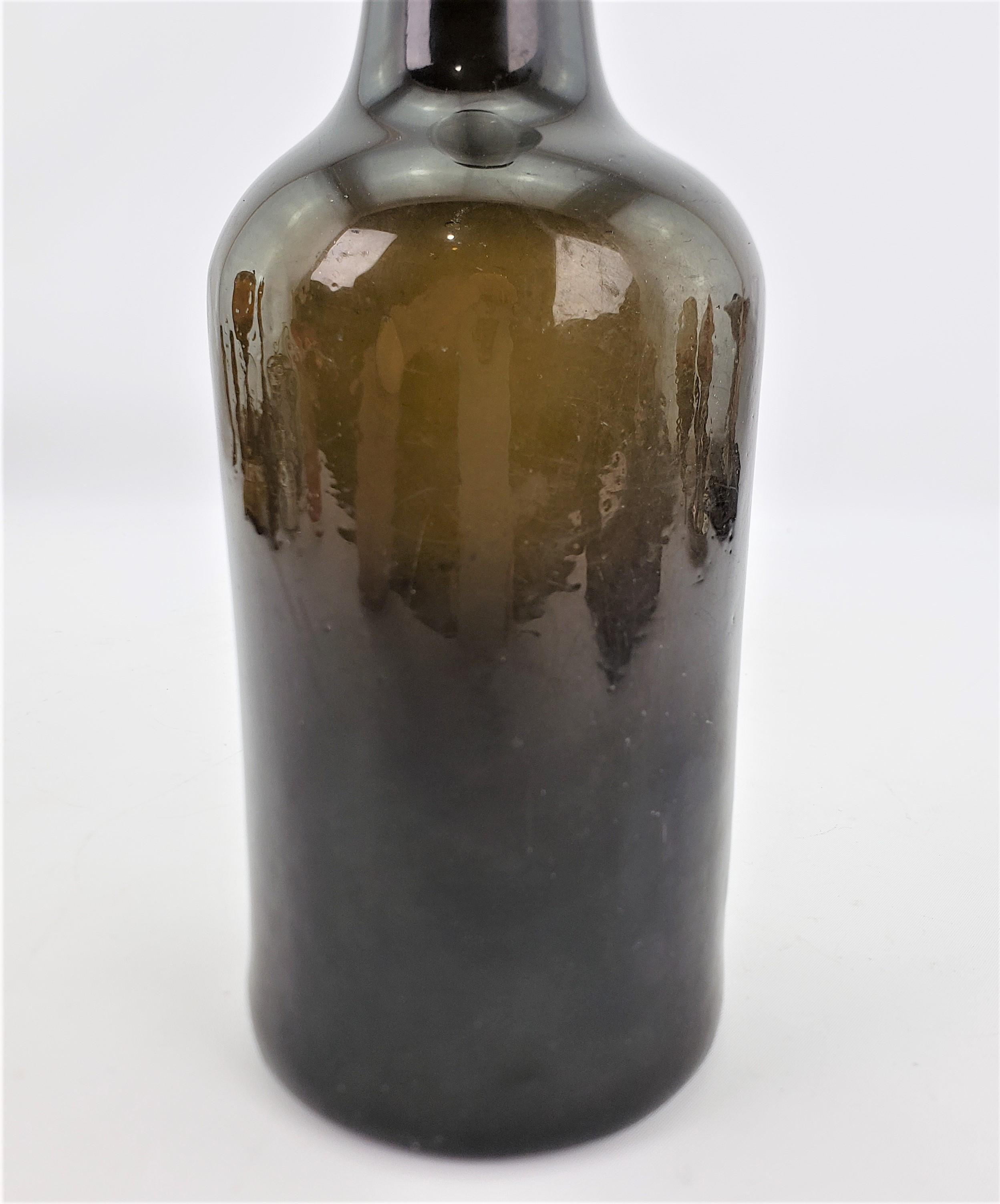 Blown Glass Antique Early 18th Century Deep Green English Mallet Formed Glass Wine Bottle For Sale