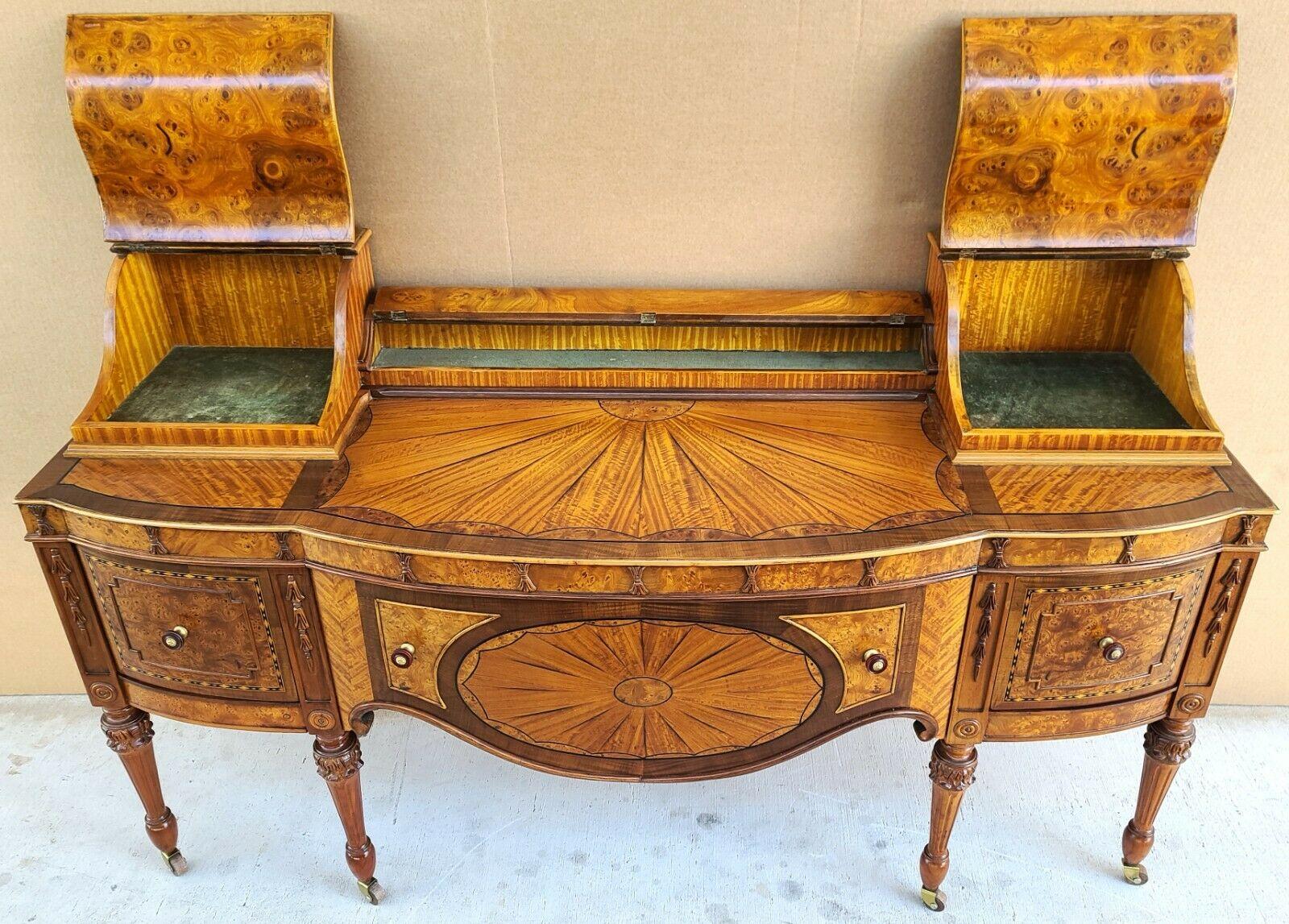 Offering one of our recent palm beach estate fine furniture acquisitions of an 
Antique early 1900s Art Nouveau Amboyna burl hand-carved walnut vanity table

Approximate measurements in inches
33