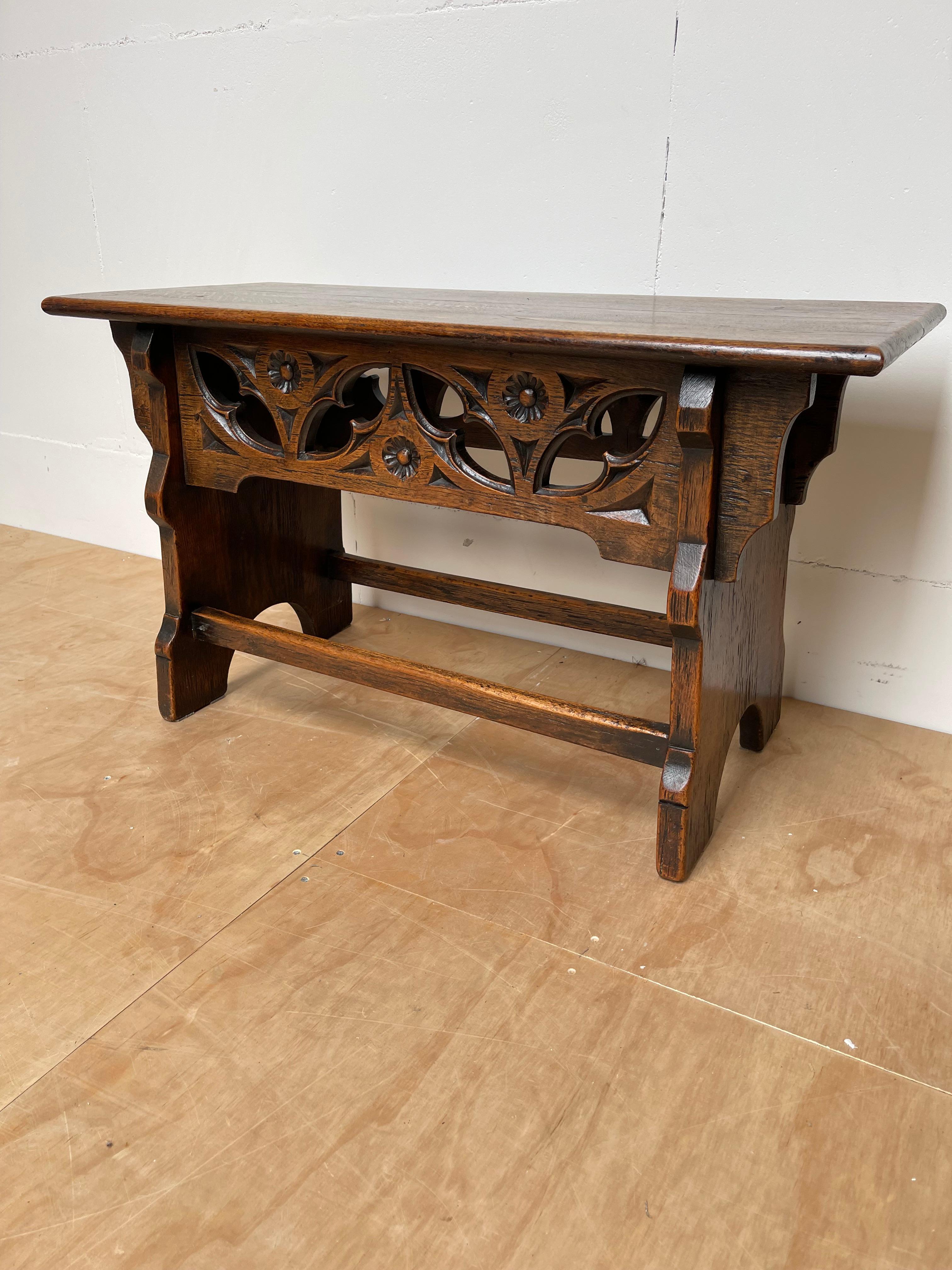 Unique, practical and highly decorative seat / hall bench with quality carvings.

This beautifully carved and striking stool is surrounded by a number of very well designed and executed Gothic elements. Combined with the marvellous patina, it makes