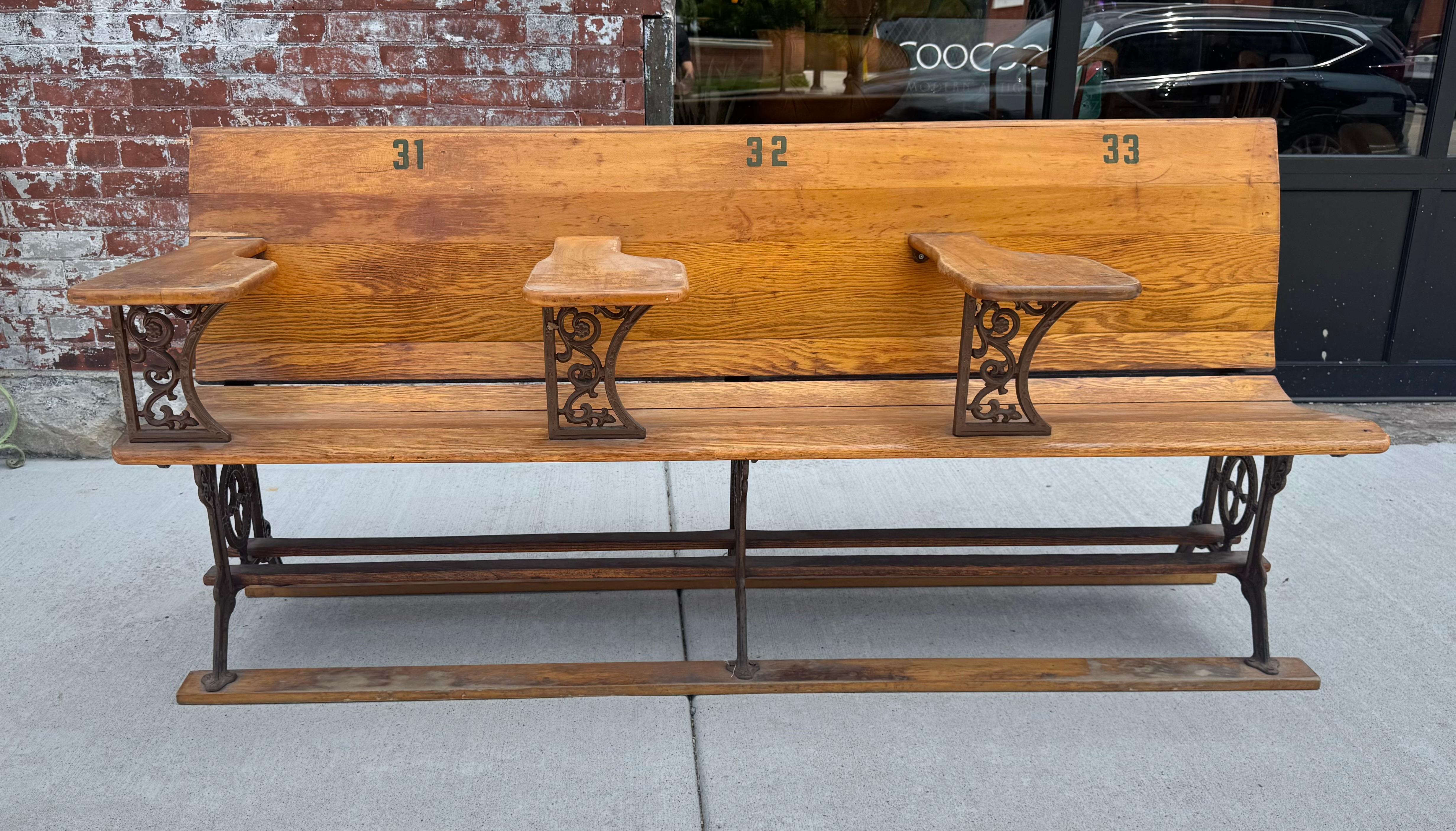 Antique early 1900's Industrial Wood &  Cast Iron School House Bench ,, Amazing design ,,retains it's original finish / patina/  charming scratches ,carved into arms,,,(see photos) wonderful cast iron.. detailed.. Extremely comfortable.. Arms