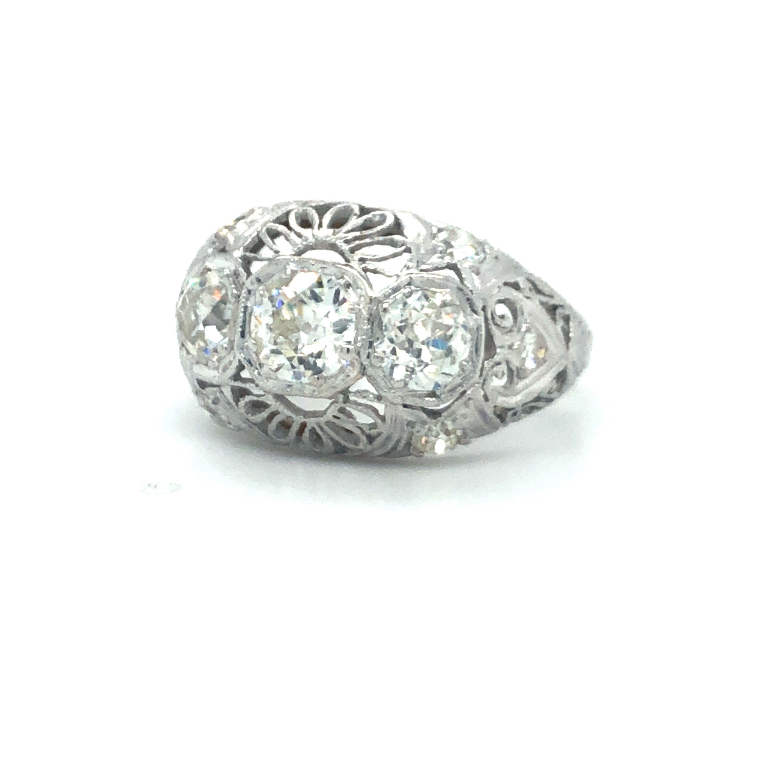 Antique Early 1900's Old Cut Diamond Three Stone Filigree Ring Platinum

Condition:  Excellent Condition, Professionally Cleaned and Polished
Metal:  Platinum (Marked, and Professionally Tested)
Diamonds:  Three Old Cut Diamonds 1.25ctw
Diamond