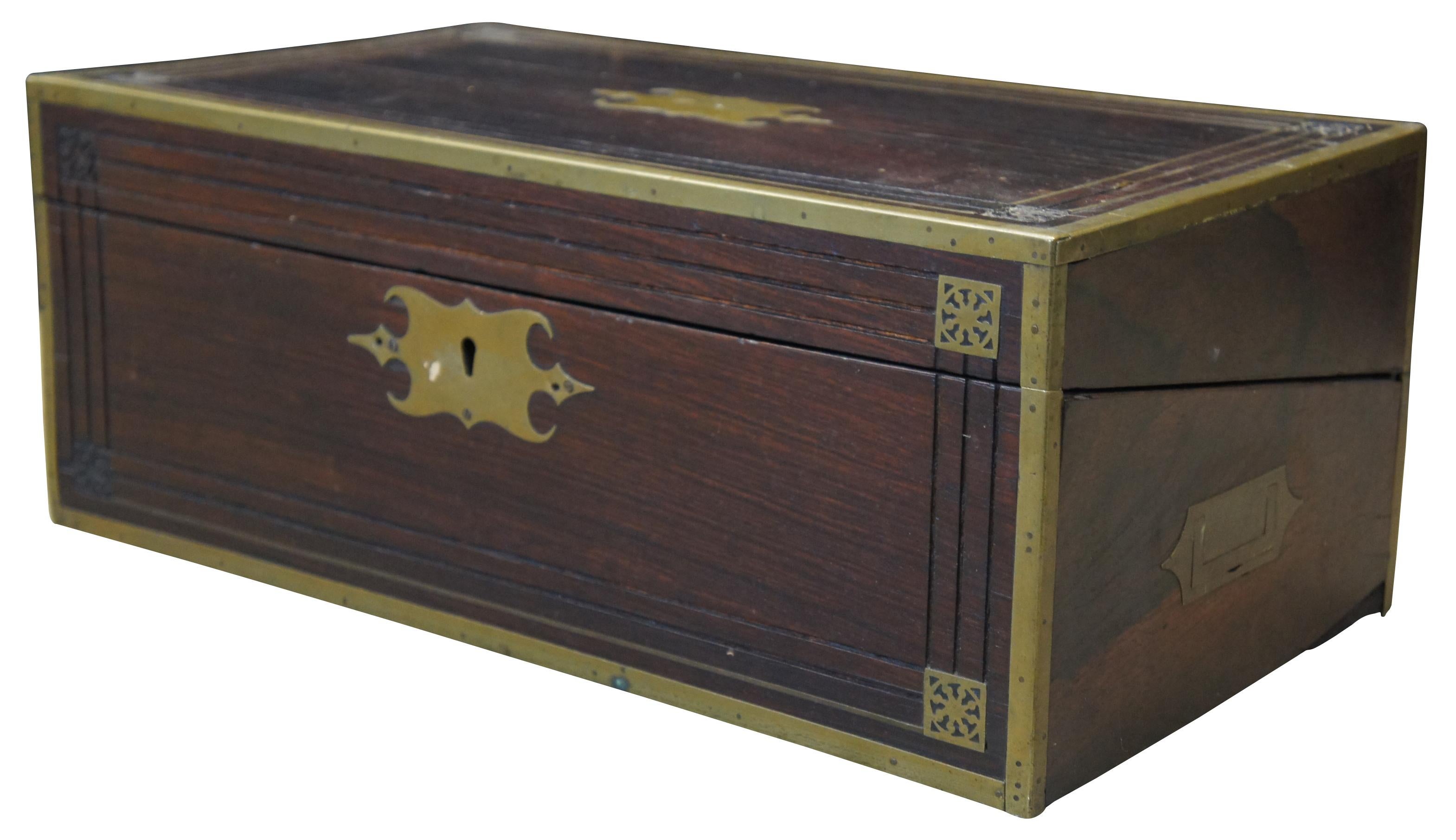 Antique early 19th century writing slope/storage chest, made of rosewood with brass hardware and inlays.
     