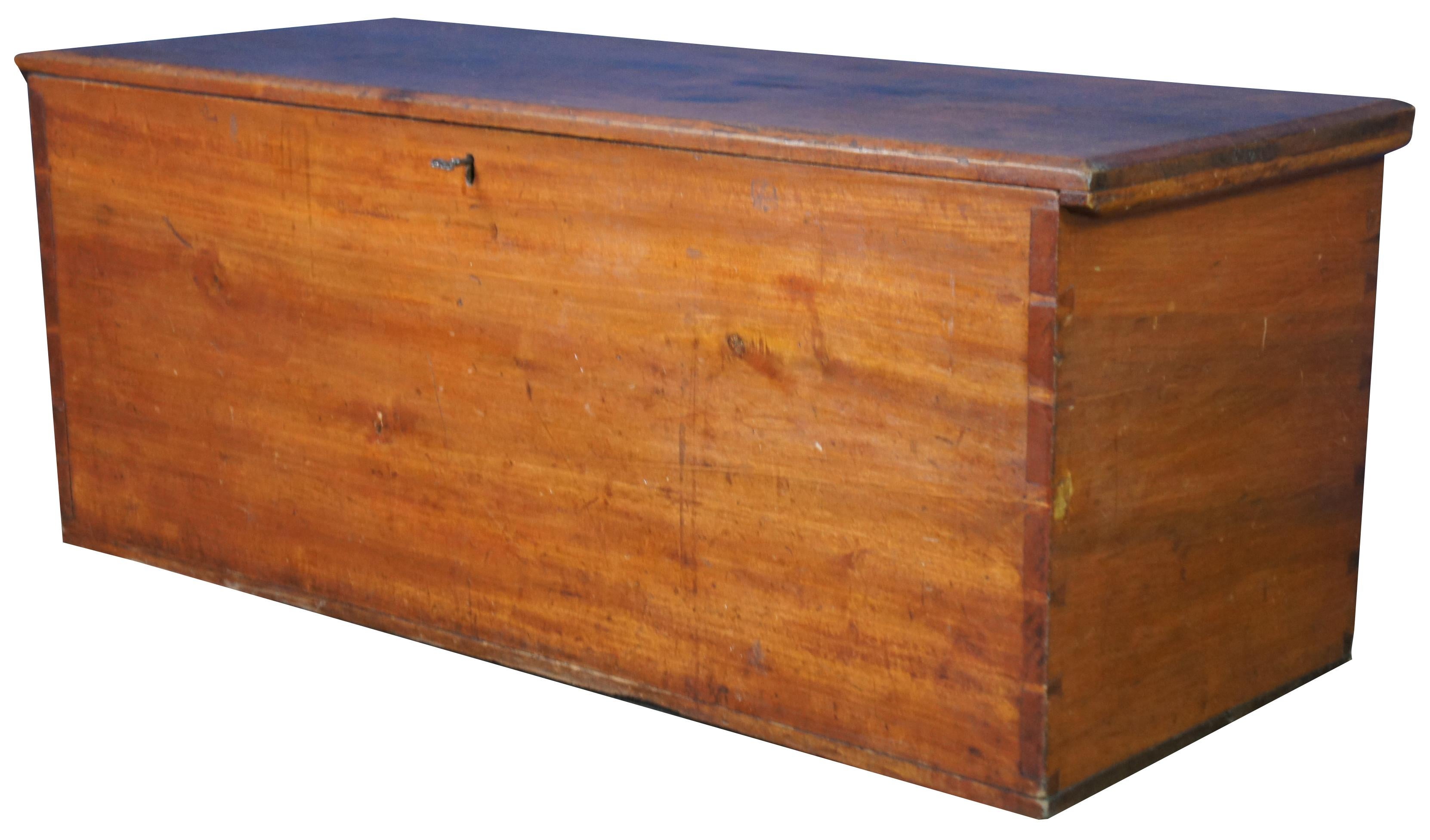 Antique country pine blanket trunk or hope chest, circa 1830s. Features primitive styling with hand dovetailing, lock and key. Measure: 43
