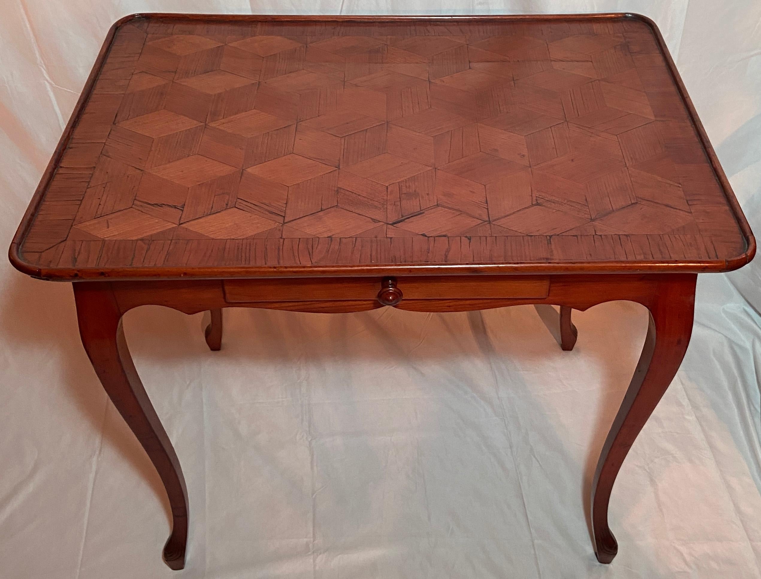 Antique early 19th century french parquetry walnut table.