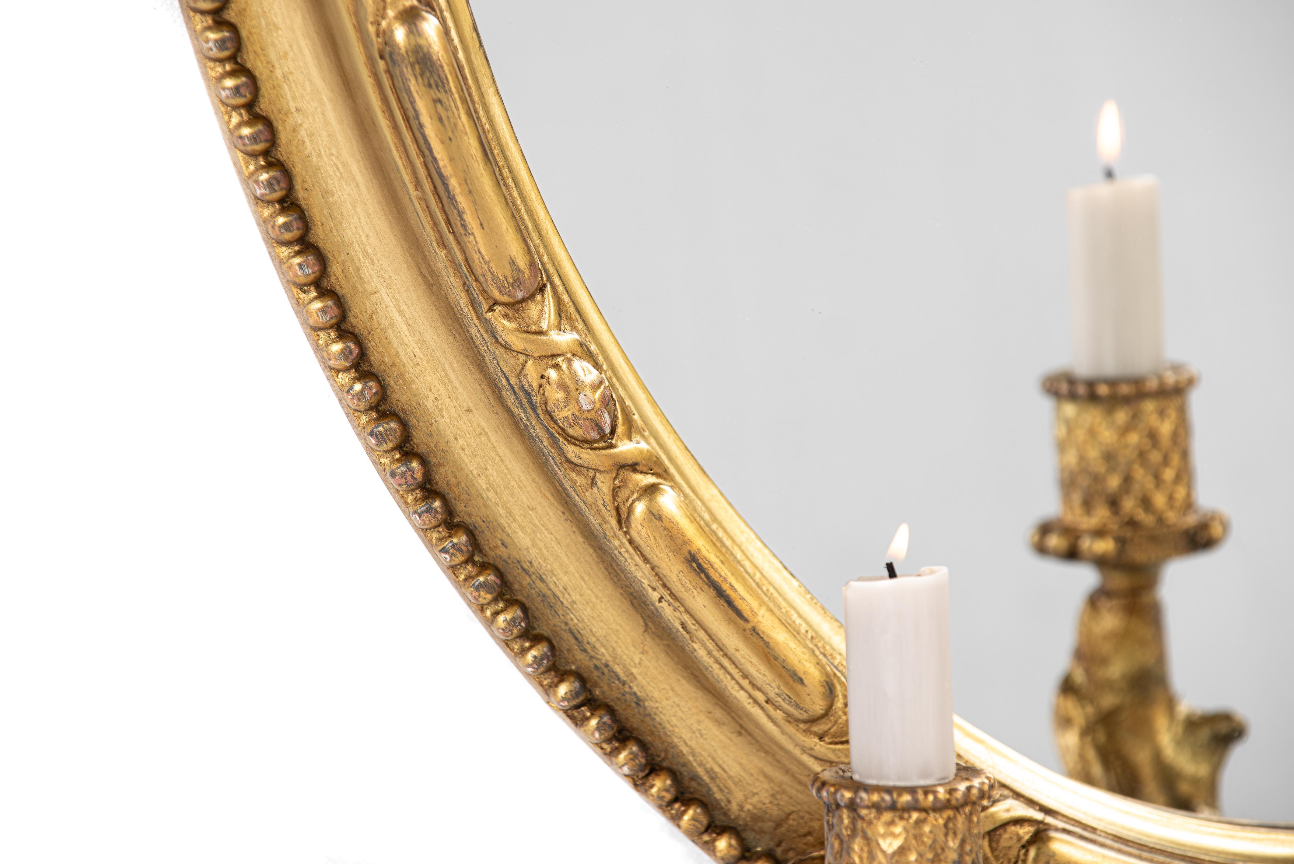 Antique early 19th century French Rococo gold oval mirror with candle holders 1