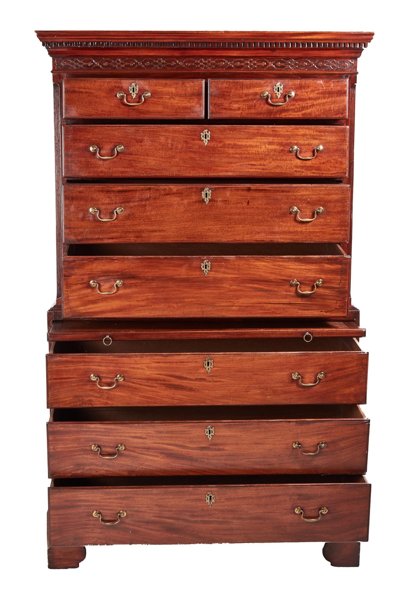 Antique George III mahogany chest on chest with the upper section having a dentil cornice and two short over three long drawers with original brass handles. The base has a brushing slide and three long graduated drawers with original brass handles.