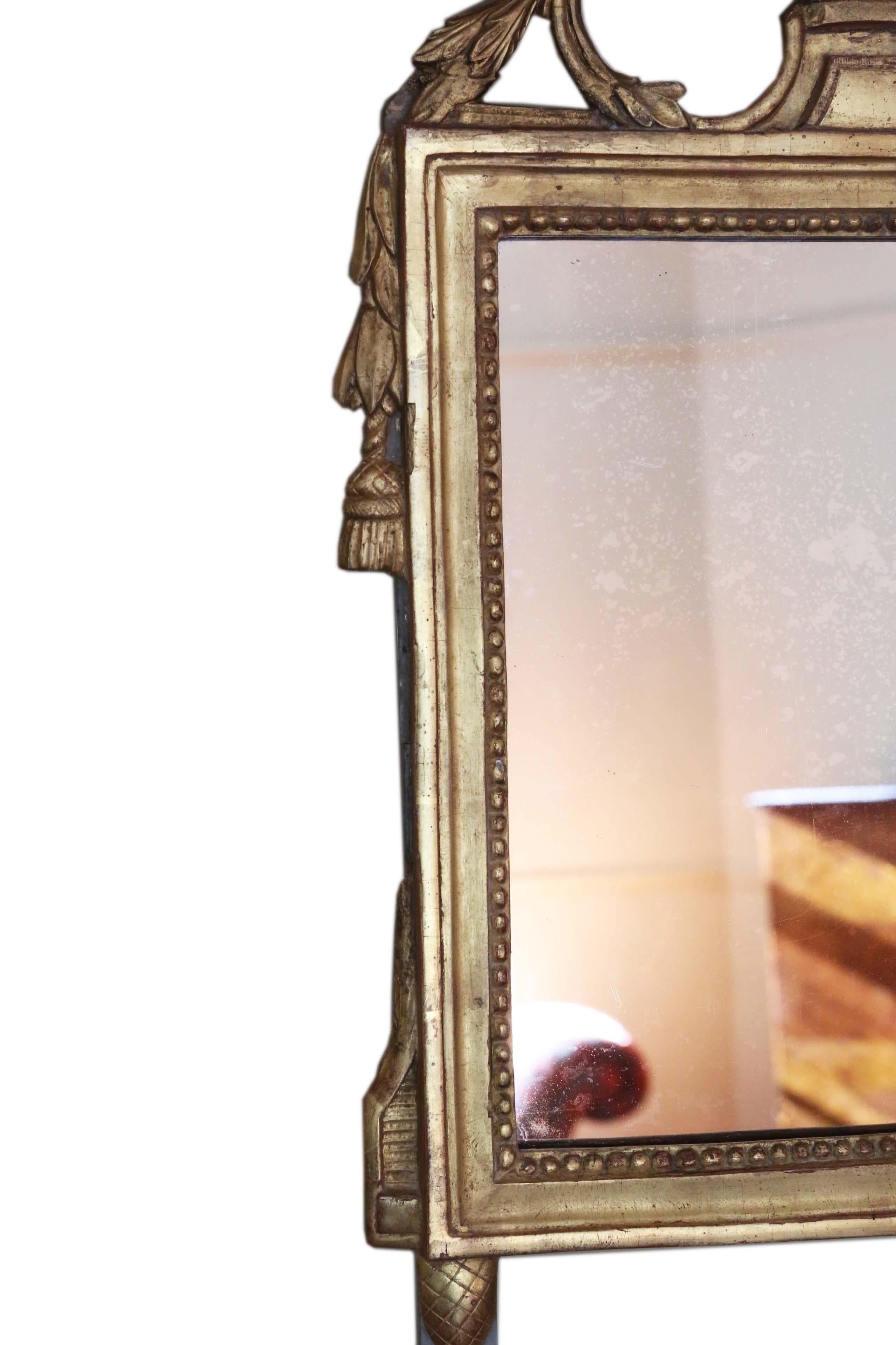 Antique quality early 19th century gilt overmantle or wall mirror. A very attractive and rare piece, with a great look.
A charming mirror, that is full of age and character. The frame has most of it's original finish and gilding, with wear and