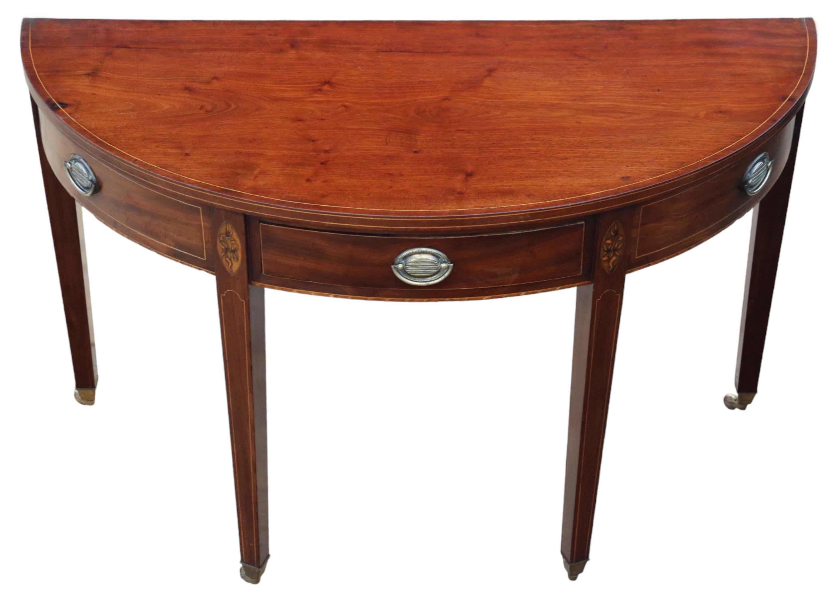Antique early 19th Century inlaid mahogany demi-lune console table.

This table is a delightful piece, exuding age, charm, and character—a very rare decorative find.

Featuring a central drawer and two dummy side drawers, it is solid with no loose