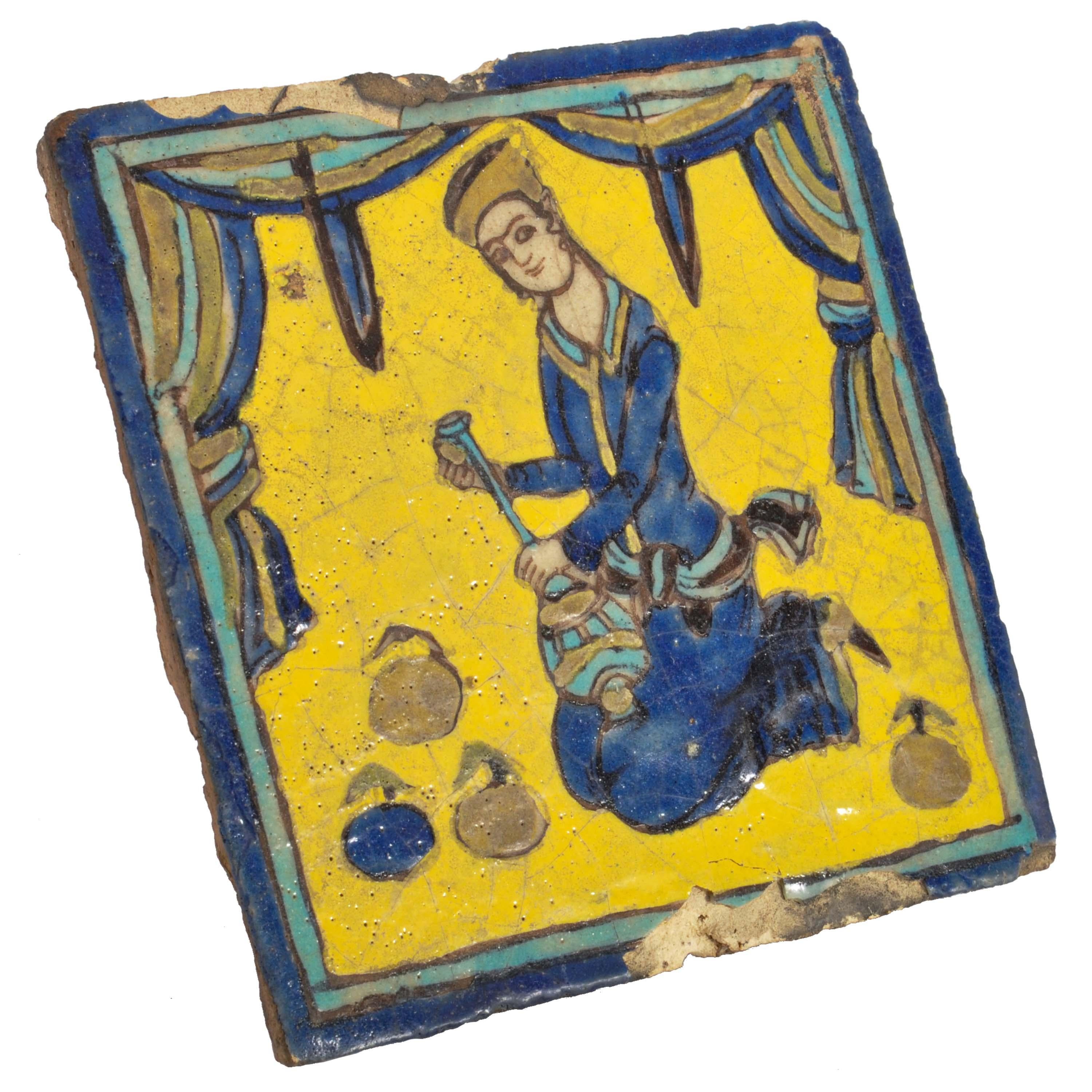 An antique Persian late Safavid or early Qajar period Islamic Cuerda Seca Pottery tile, circa 1780.
The tile of square form with a yellow ground with polychrome decoration of a musician playing a Persian setar. 
Condition is good, minor nibbles to