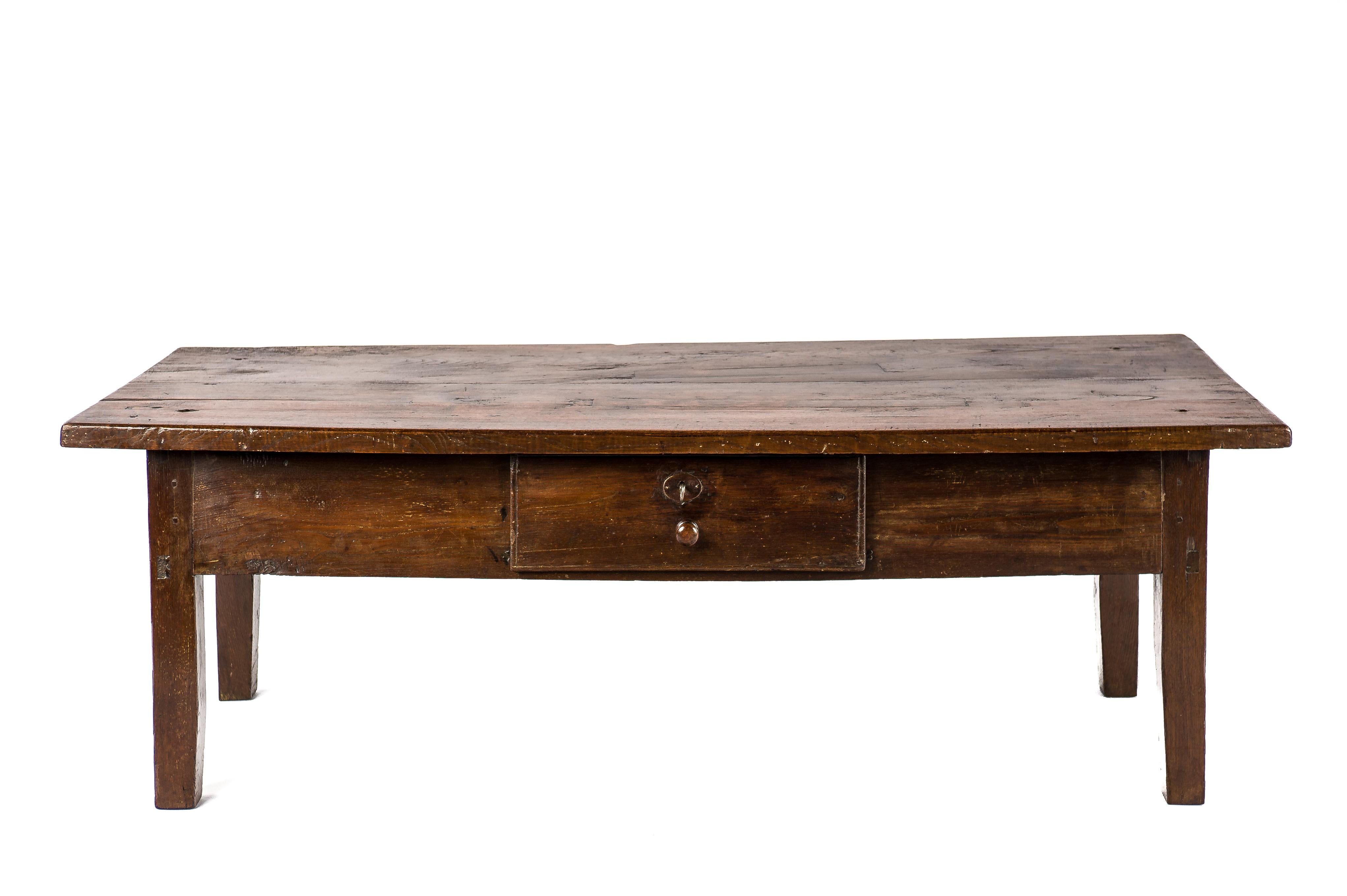 This beautiful warm brown color rustic coffee table or low table originates in rural Spain and dates circa 1820. The table has a fantastic top that was made from two boards of solid chestnut wood 1.38 inches thick. The top has a beautiful grain