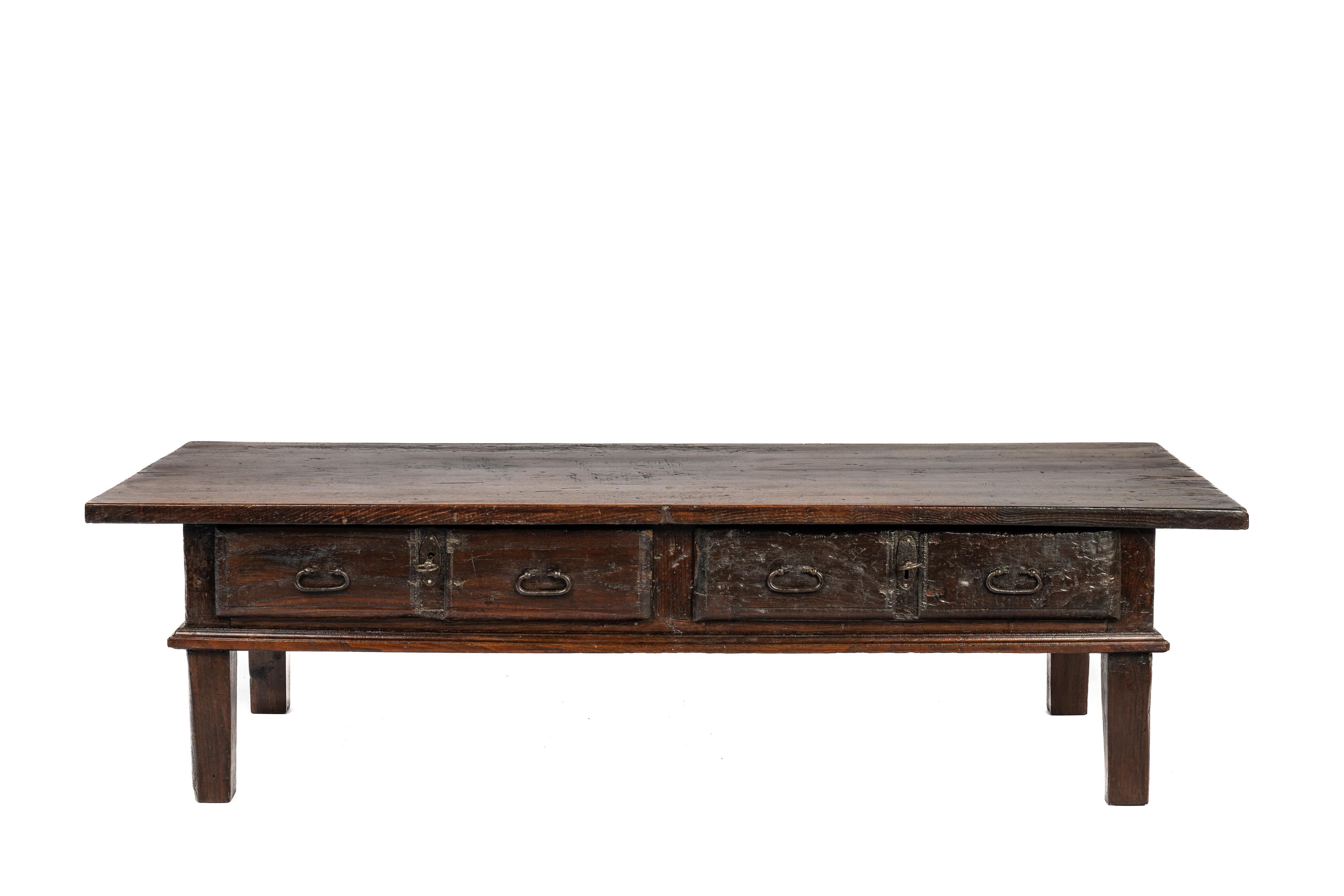 On offer here is a fantastic coffee table or low table that originates in rural Spain and dates circa 1800. The table has a unique top that was made from one single board of solid chestnut wood that is 1.2 inches thick. The top has a beautiful