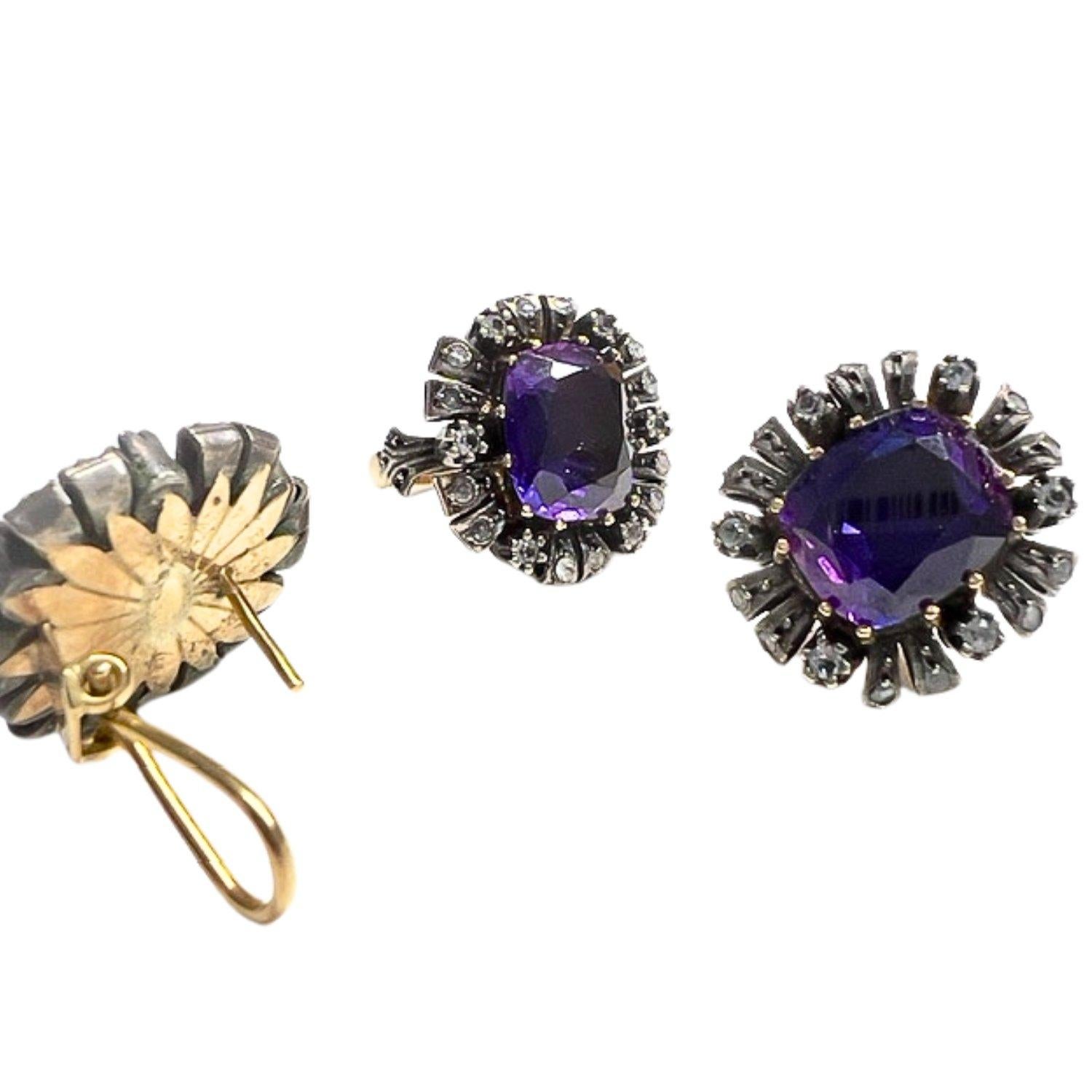 This antique set of earrings and a ring from the early 19th century is crafted in 18K gold and silver and features Sapphires. 
The total weight of the set is 21.4 grams, with 50% of the metal being 18K gold and the remaining 50% being sterling