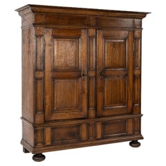 Antique early 19th century solid oak warm brown two door german cabinet