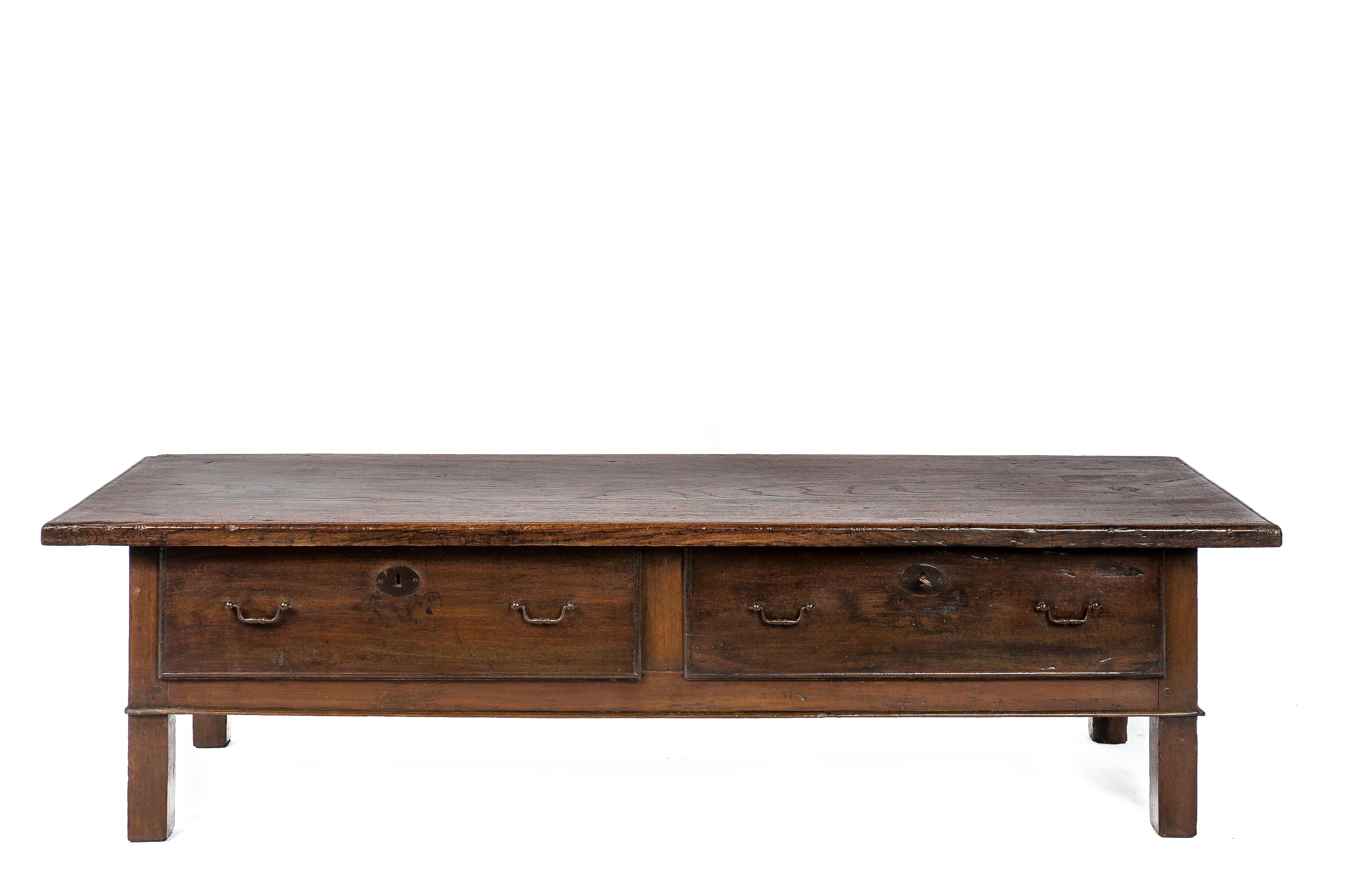 This beautiful antique chestnut coffee table was made in Spain around 1820. The table has a top made from a single board of solid Chestnut and displays a wonderful grain pattern and deep gloss. The top has a thickness of 1.38 inches and has simple