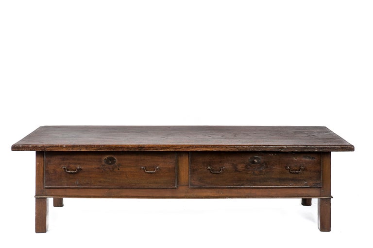 This beautiful antique chestnut coffee table was made in Spain around 1820. The table has a top made from a single board of solid Chestnut and displays a wonderful grain pattern and deep gloss. The top has a thickness of 1.38 inches and has simple