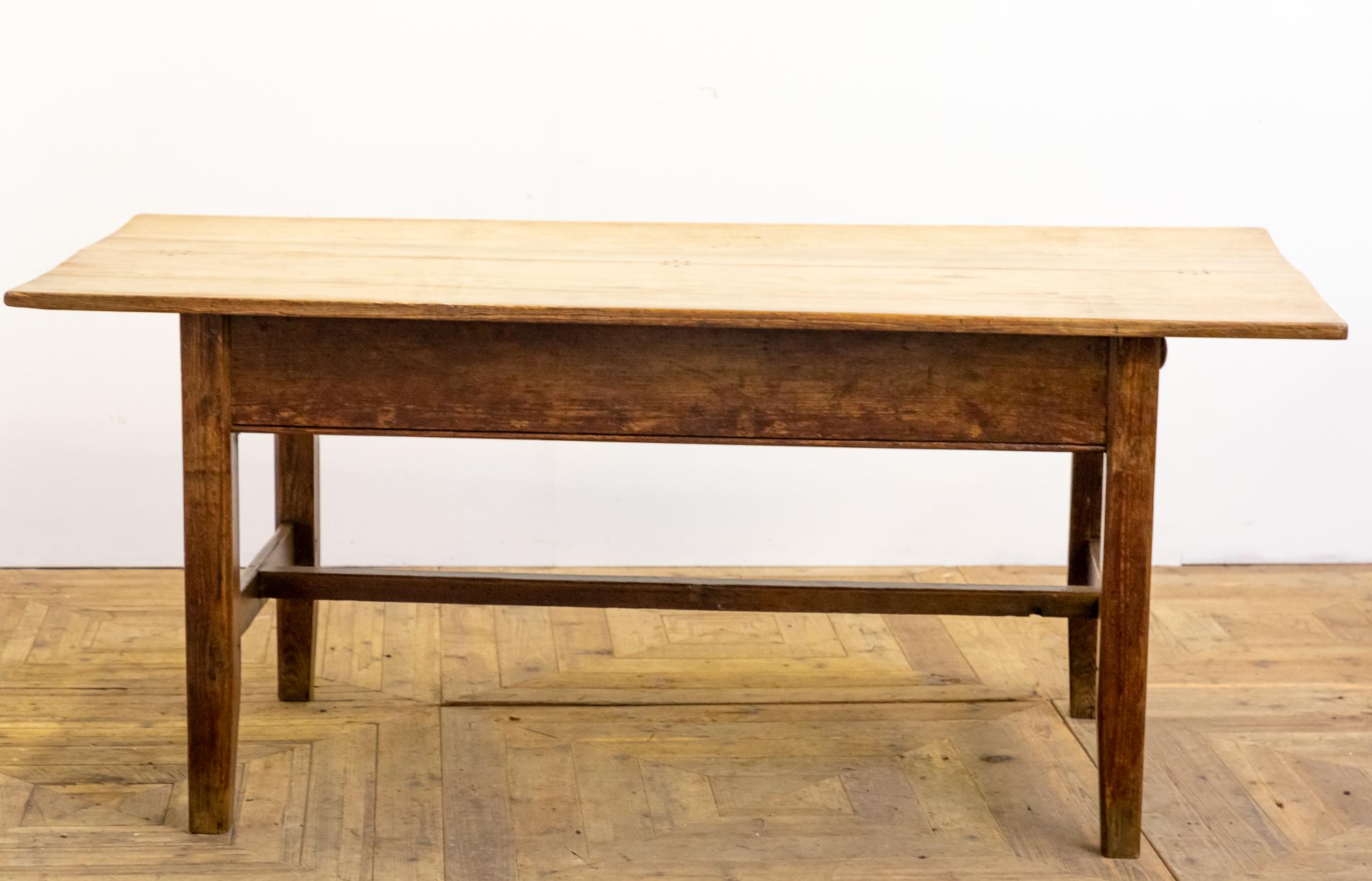 A stunning early 19th century welsh two plank top dairy table. The table is constructed from pine and retains the original finish to the frame. The top of traditional scrubbed pine is formed from two planks with the customary six dowel fixing. The
